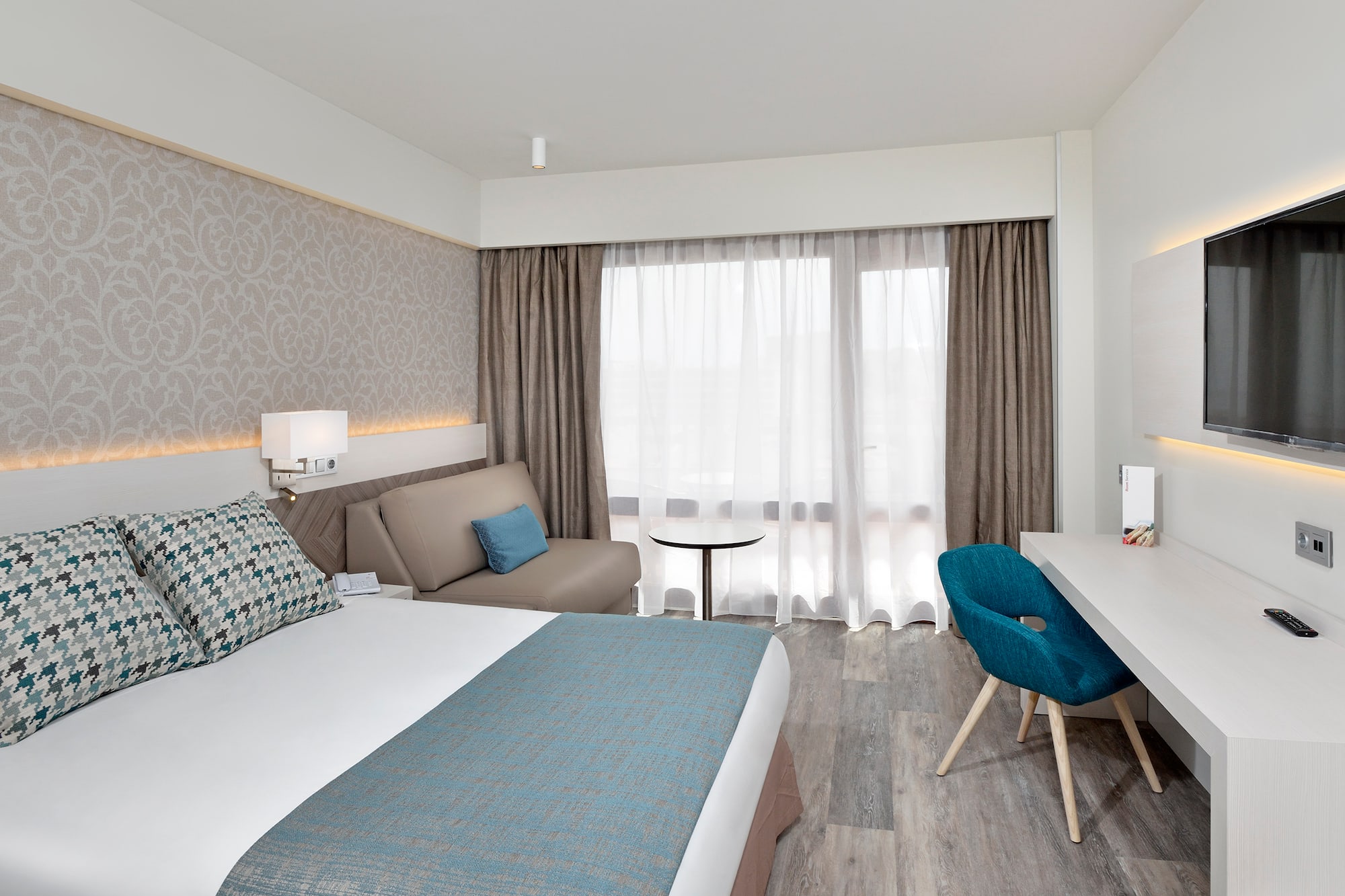 a room with a bed and a desk