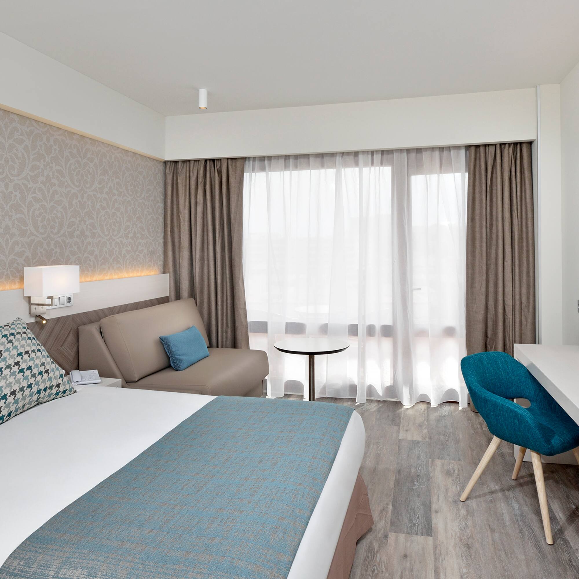 a room with a bed and a desk