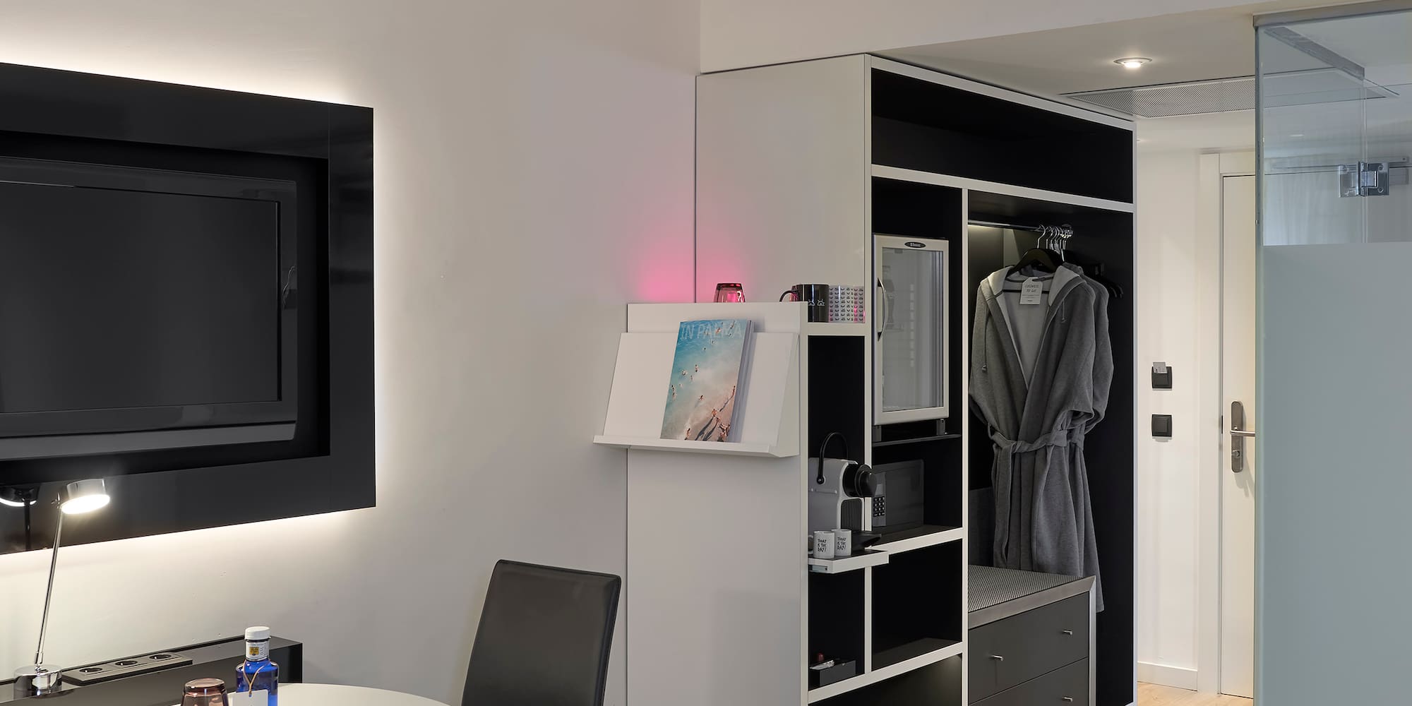 a room with a tv and a table