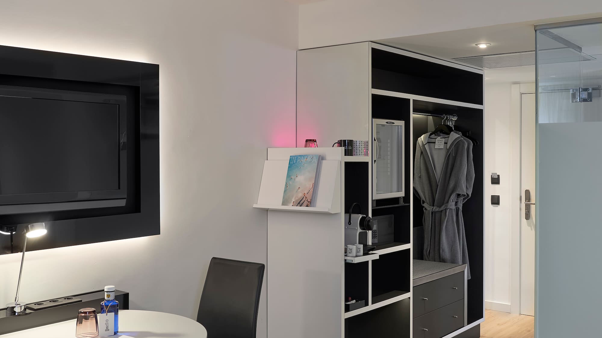 a room with a tv and a table