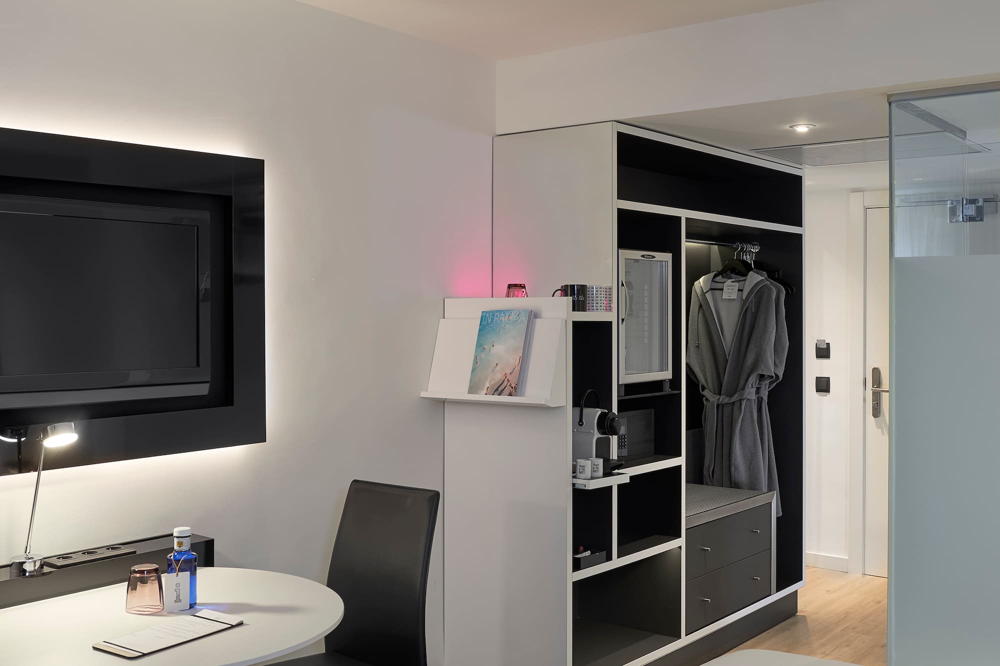 a room with a tv and a table