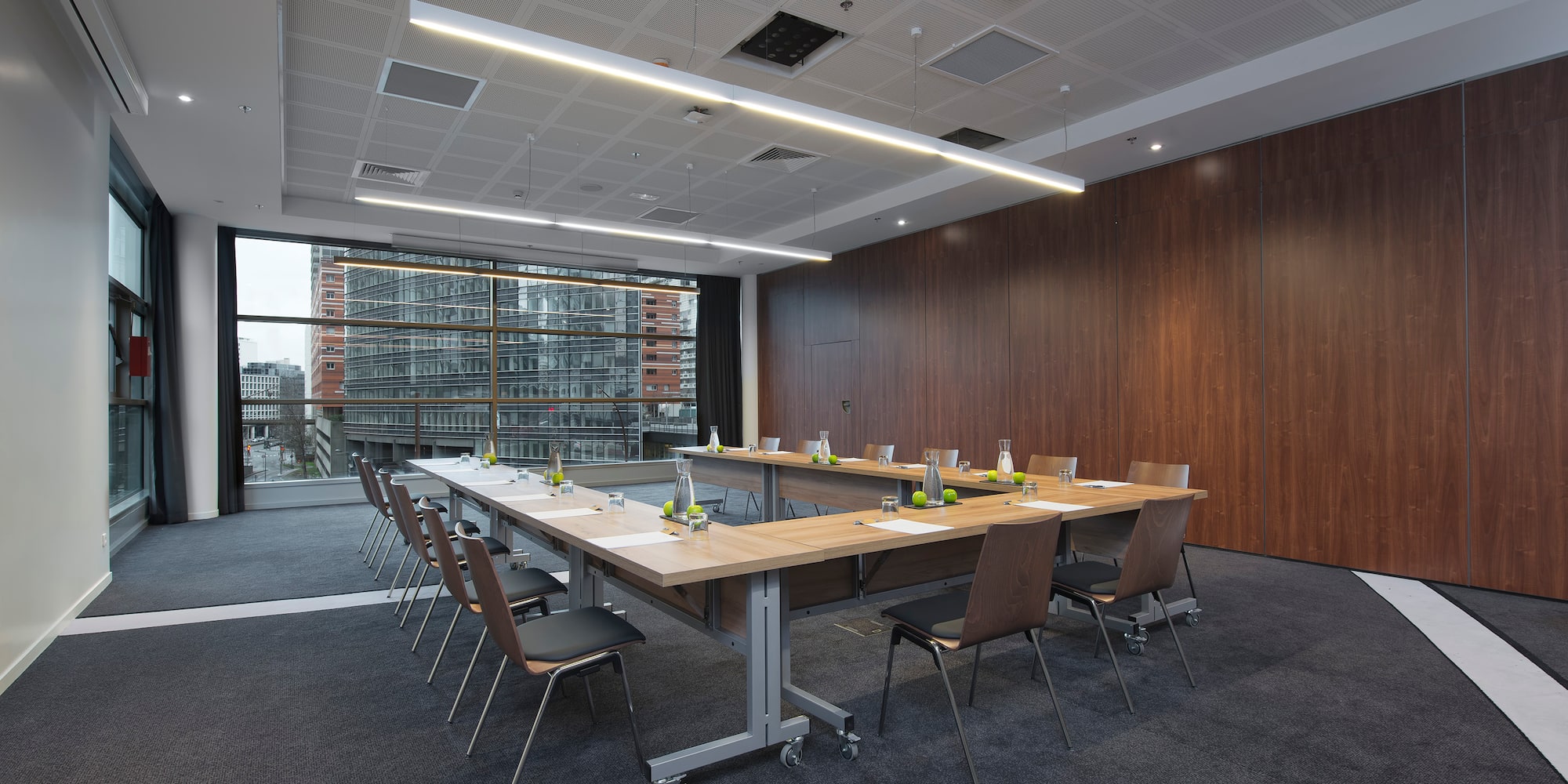 a conference room with a table and chairs