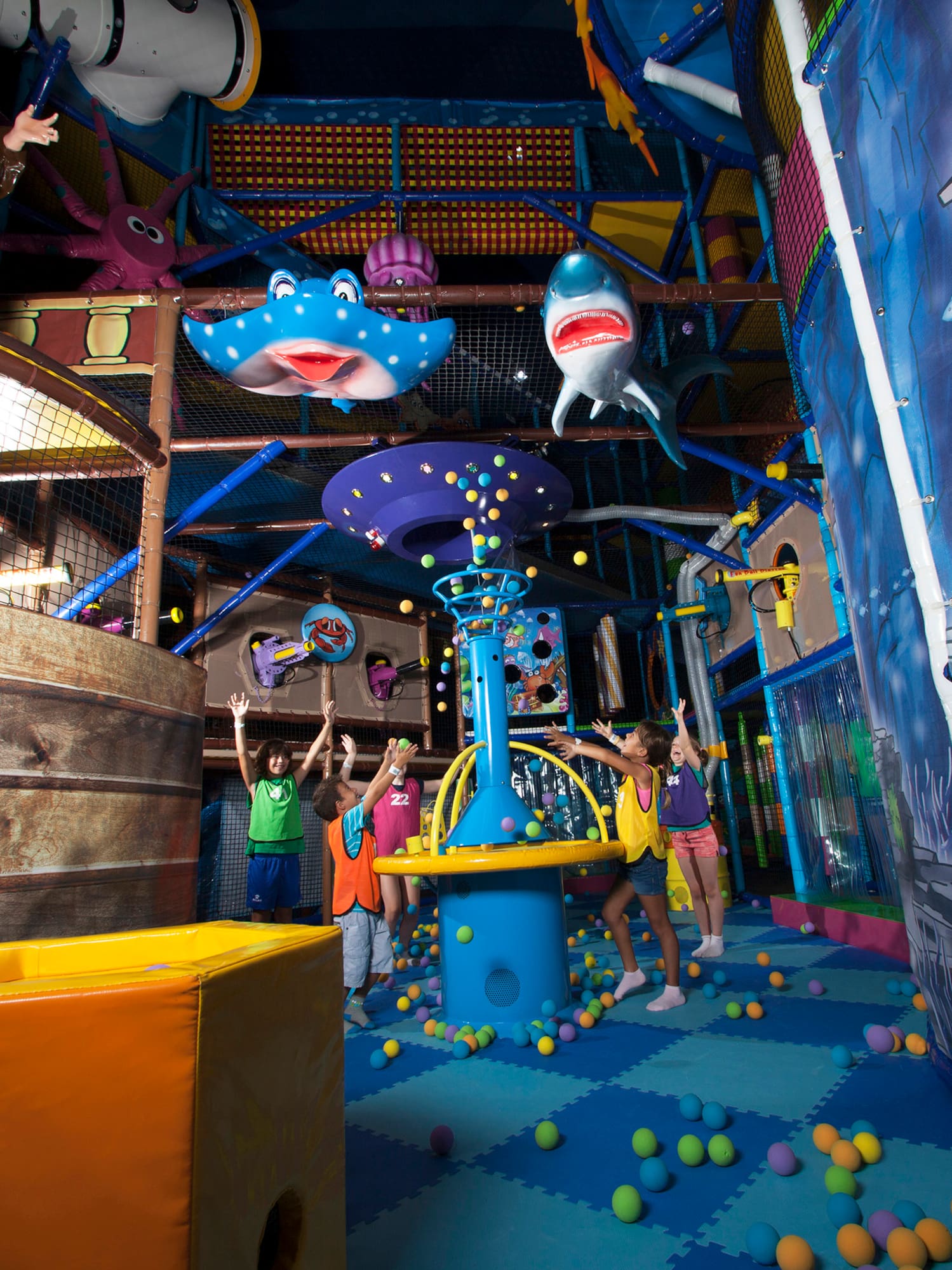 a group of people in a play area