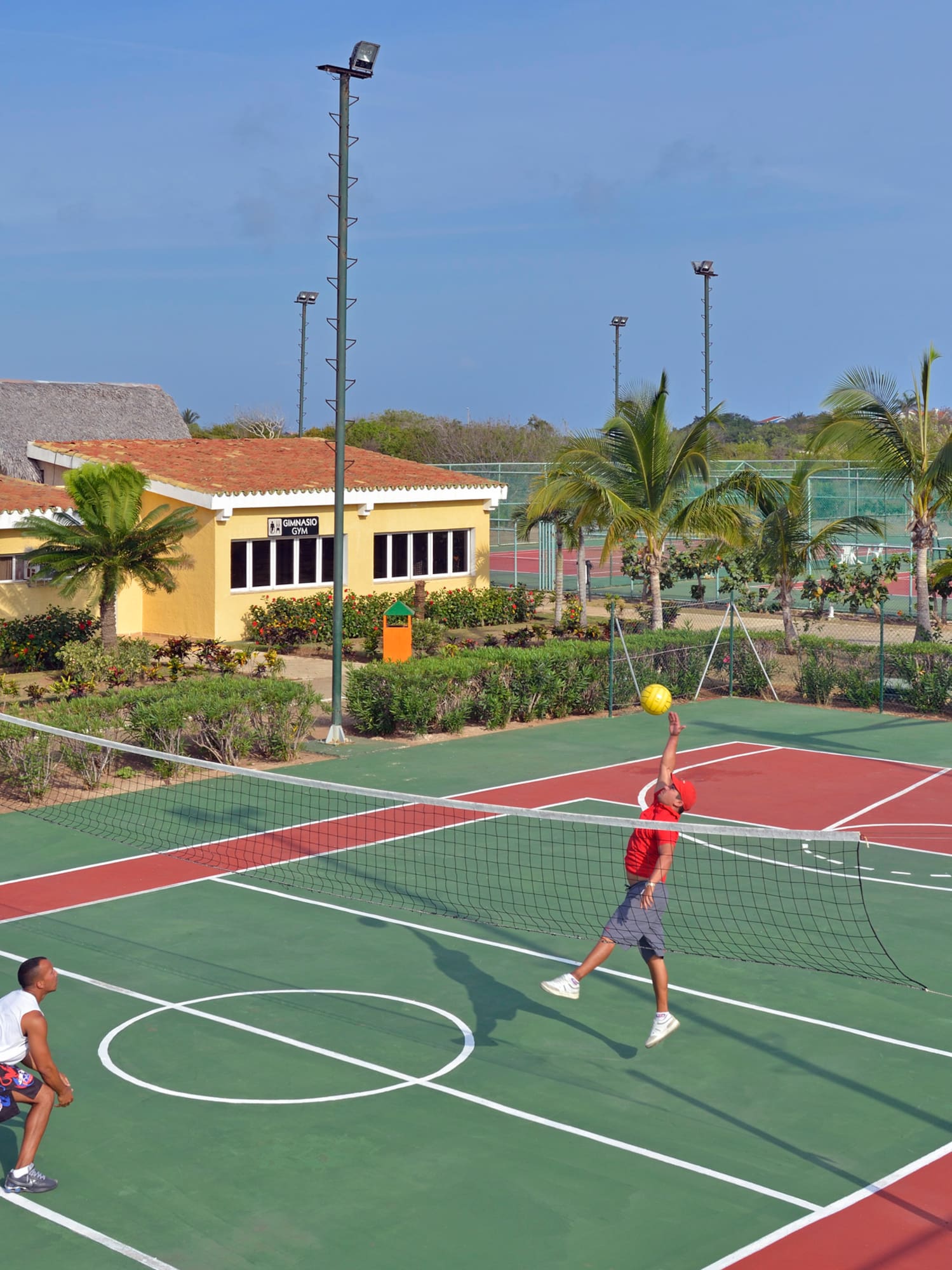 a man playing tennis on a court