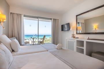 a room with a large window overlooking the ocean