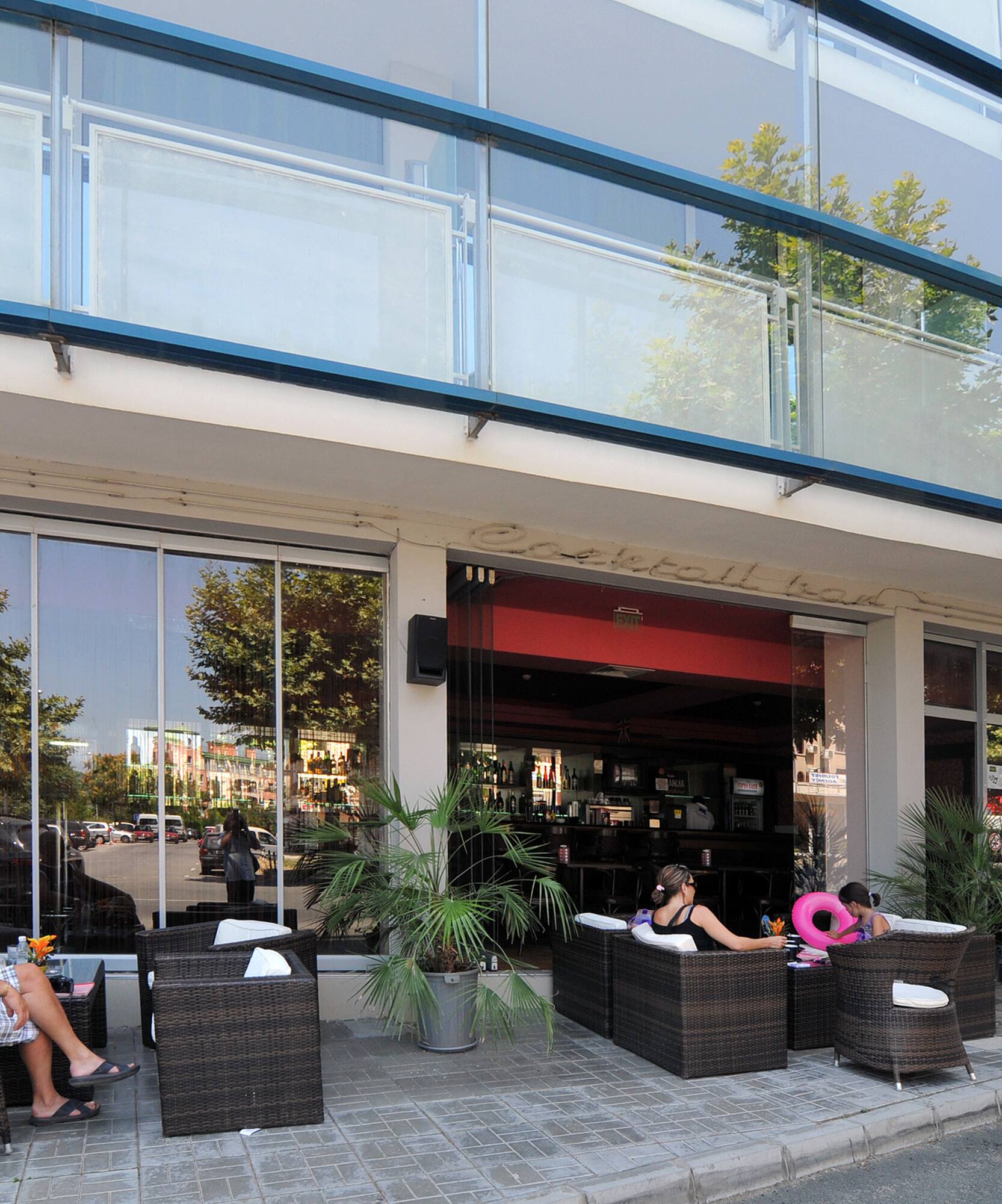 people sitting outside a building