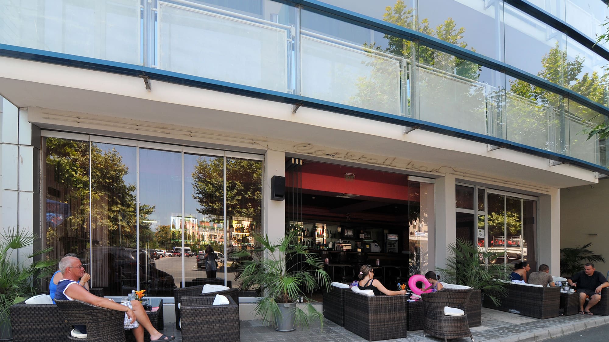 people sitting outside a building
