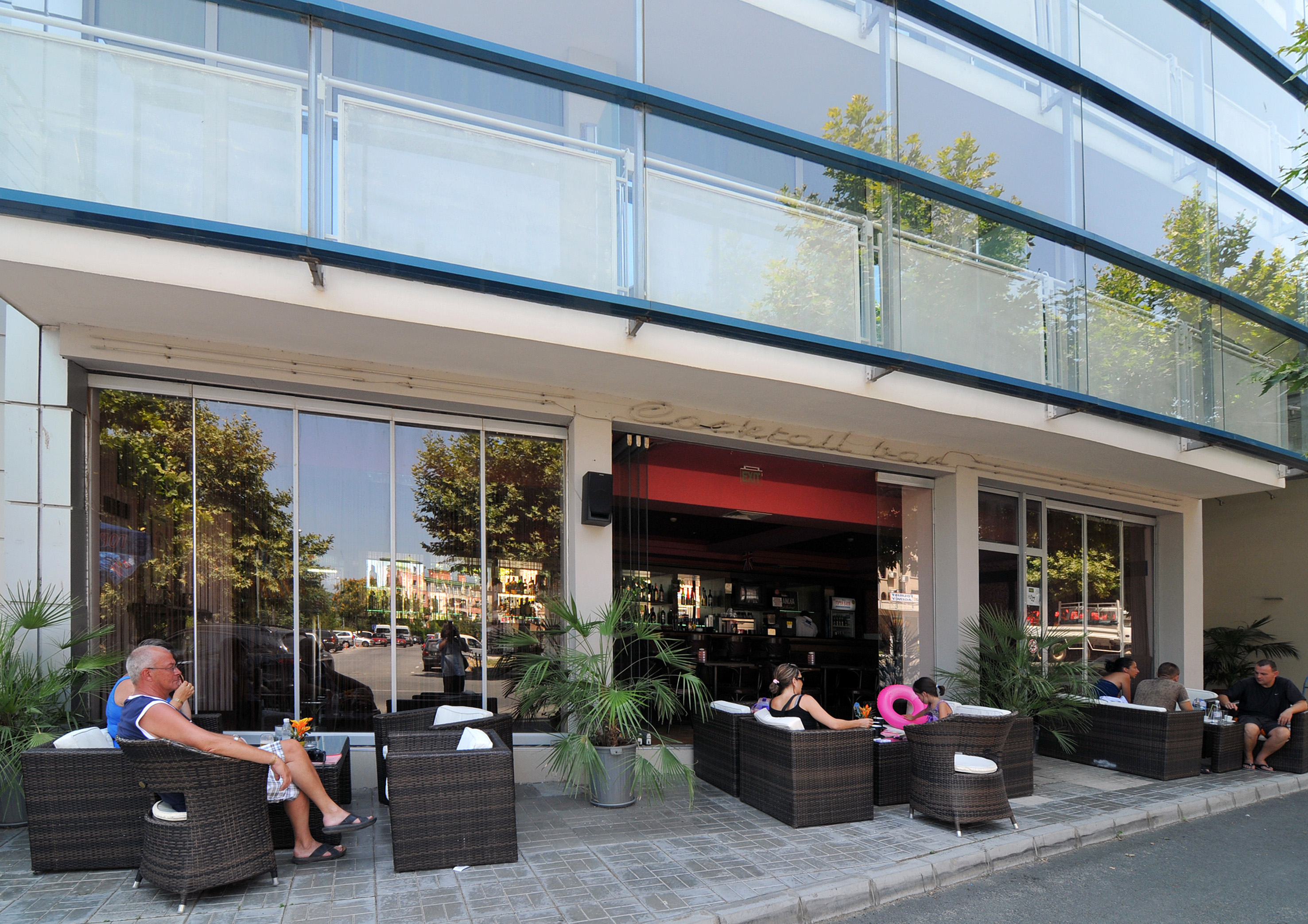people sitting outside a building