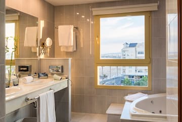 a bathroom with a tub and a sink