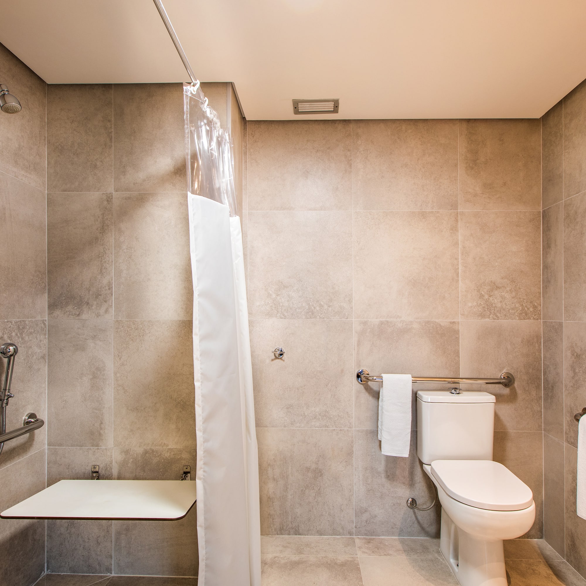 a bathroom with a shower curtain and a toilet