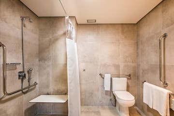 a bathroom with a shower curtain and a toilet