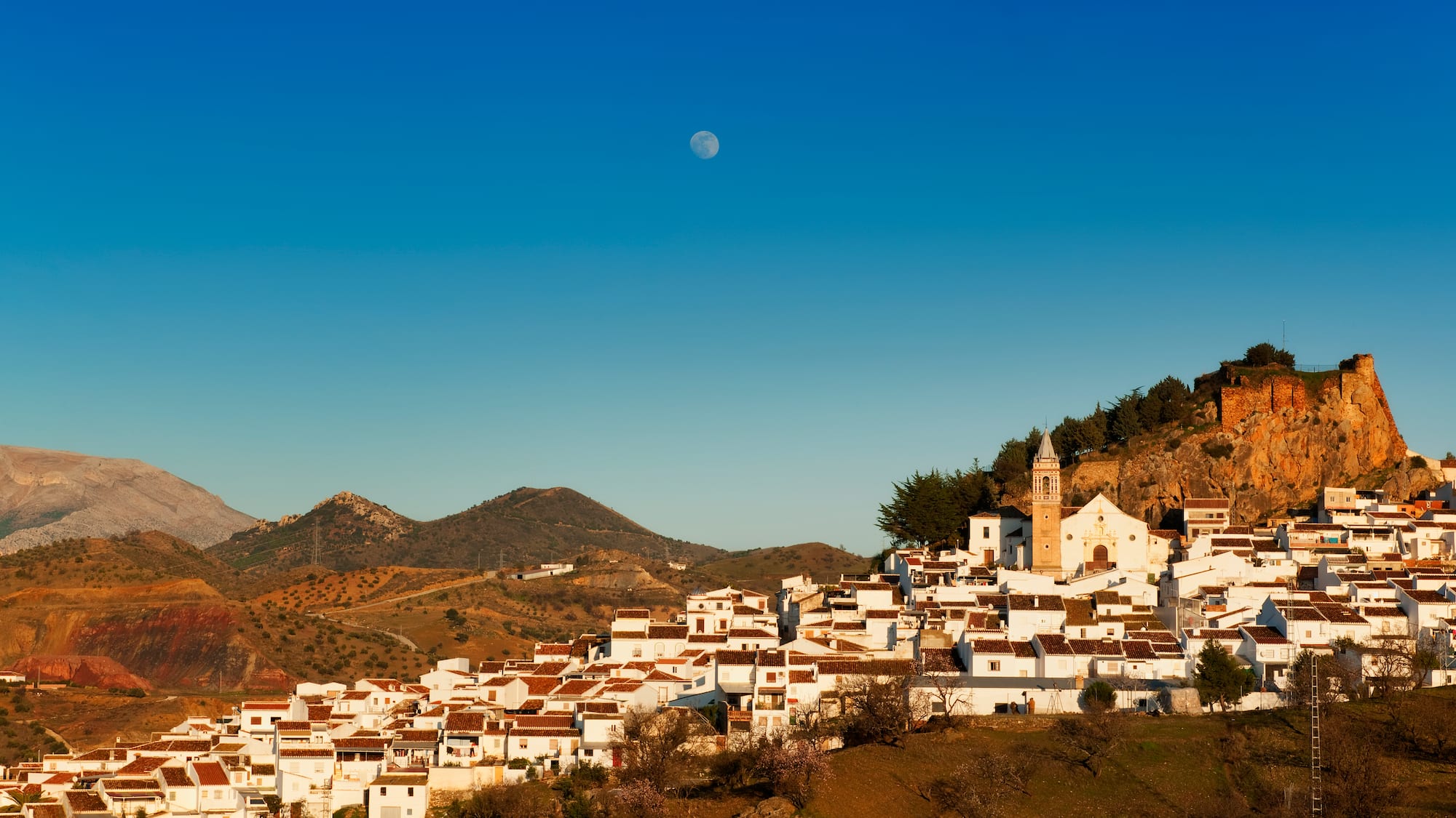 a white buildings on a hill
