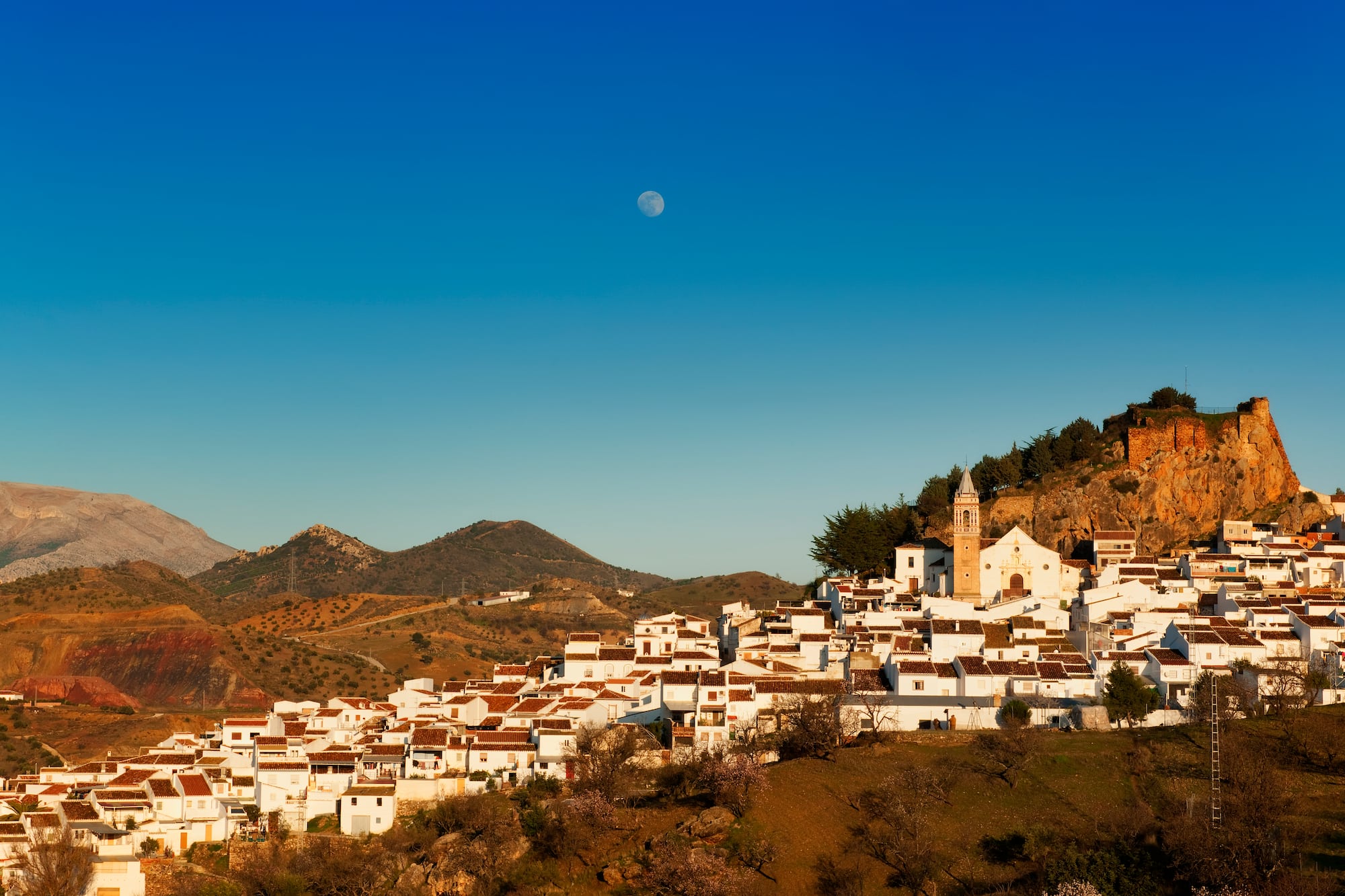a white buildings on a hill