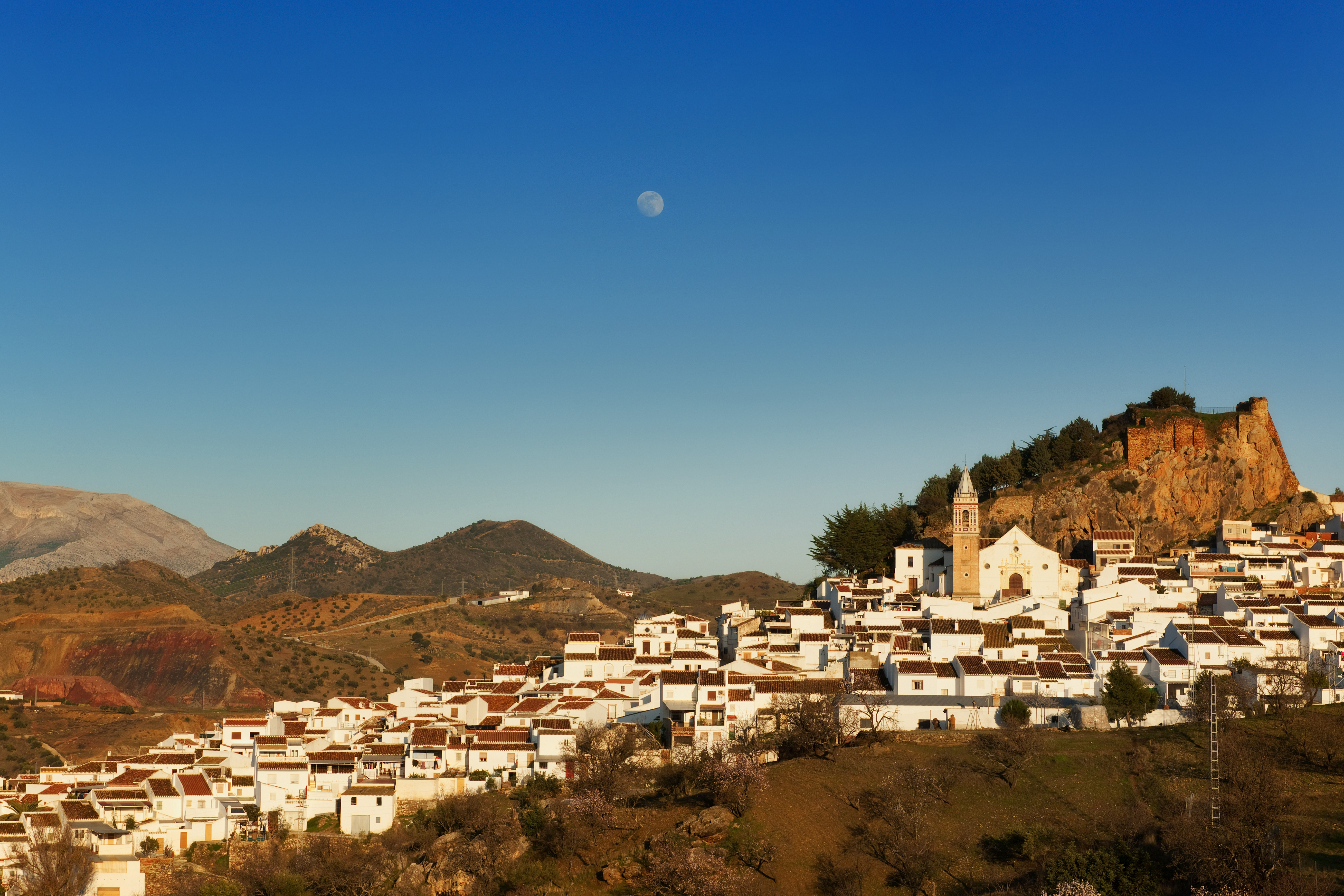 a white buildings on a hill