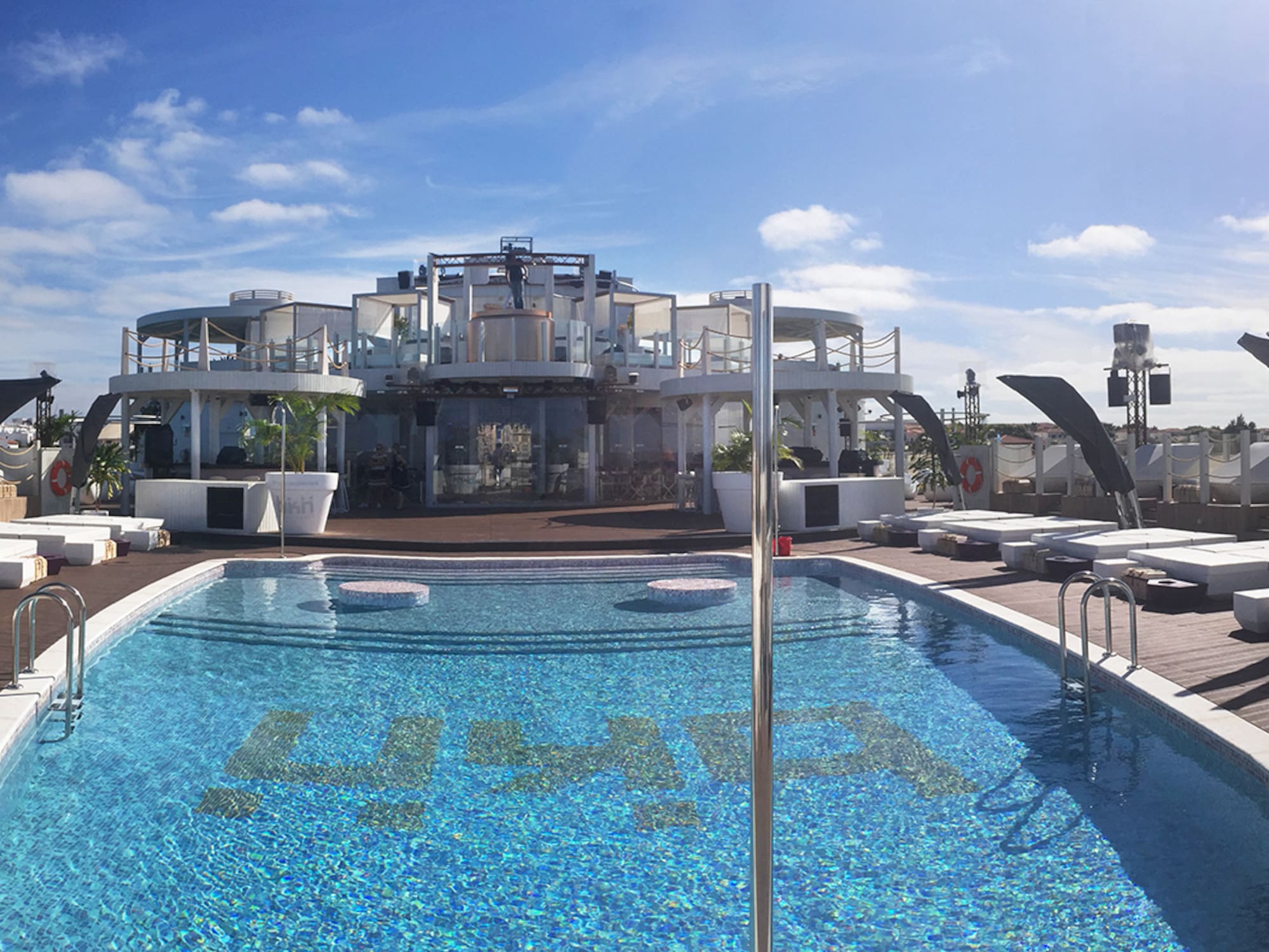 a pool with a building in the background