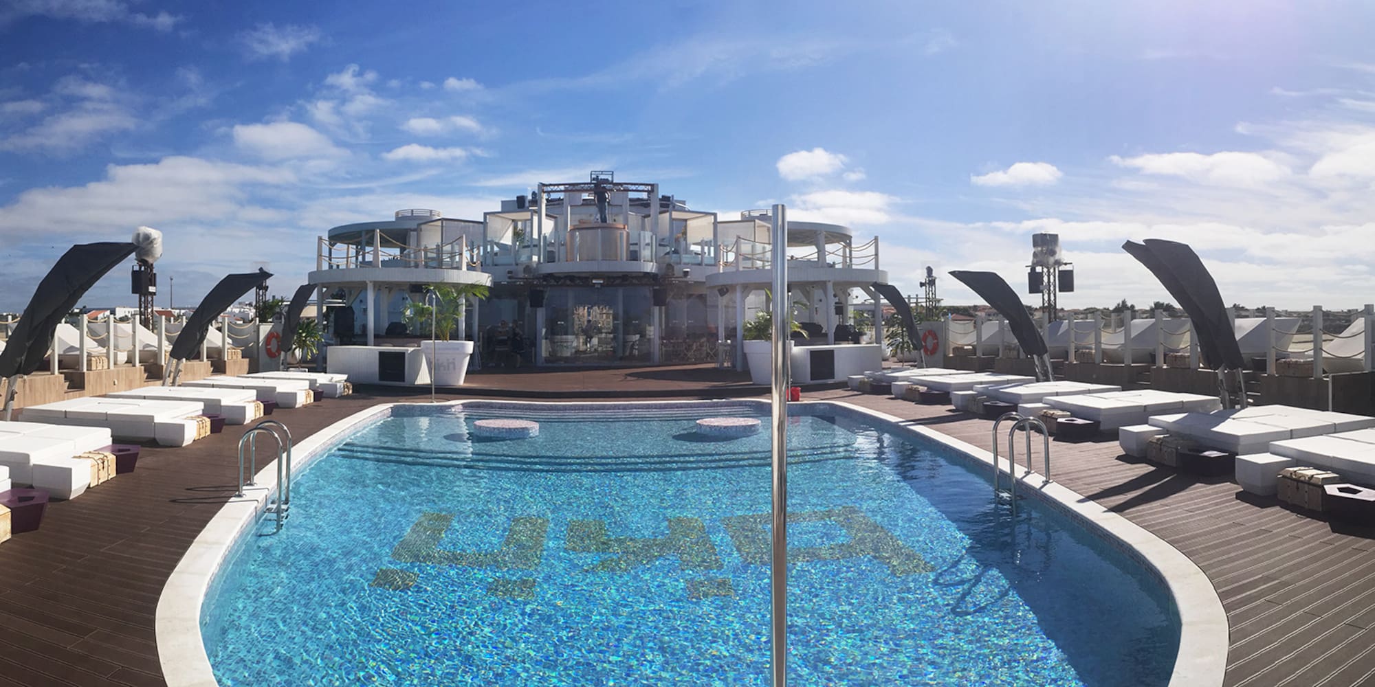 a pool with a building in the background
