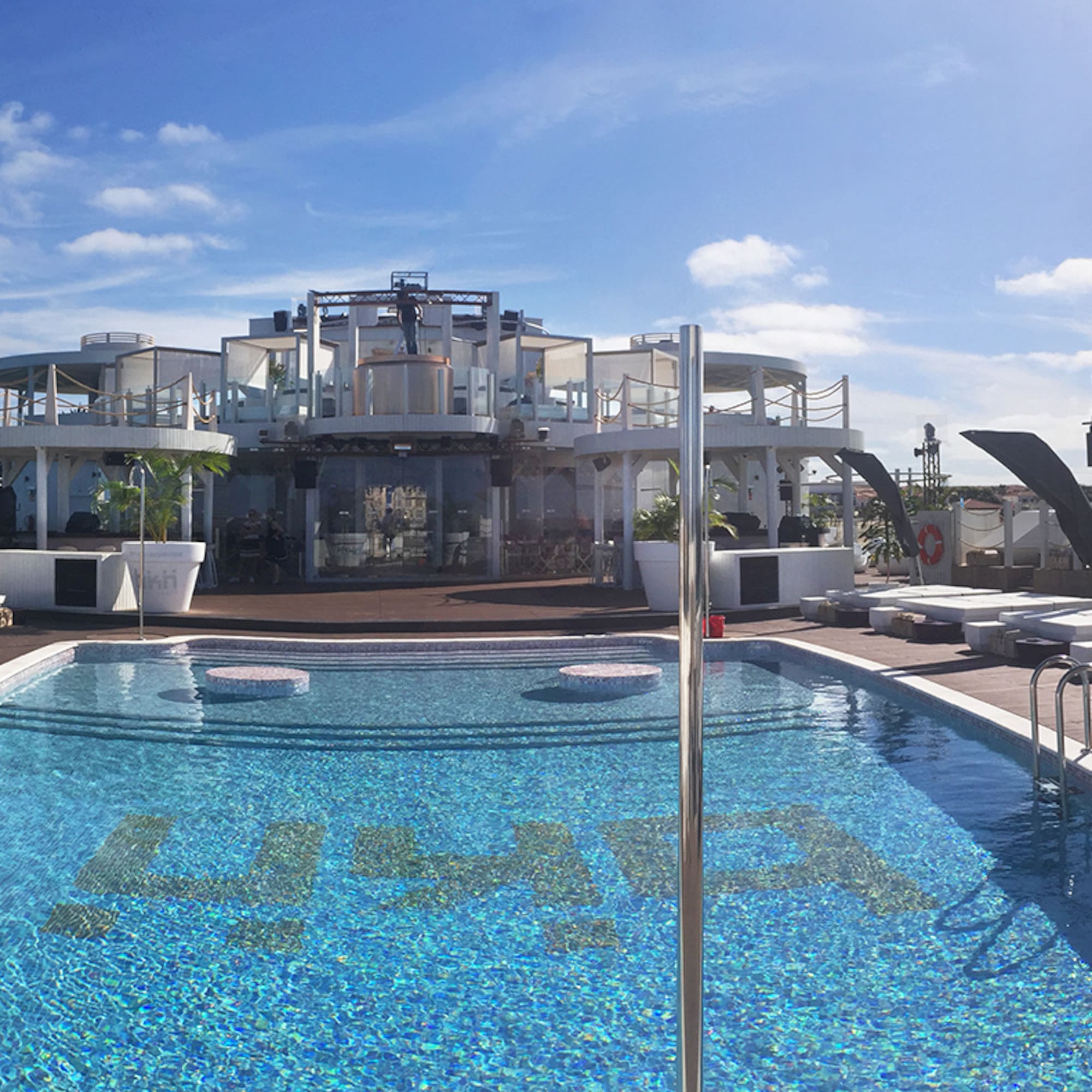 a pool with a building in the background