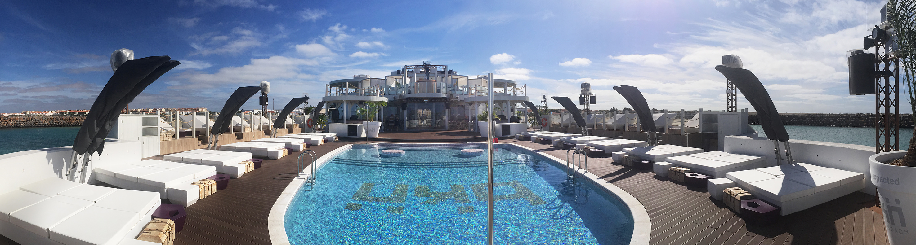 a pool with a building in the background