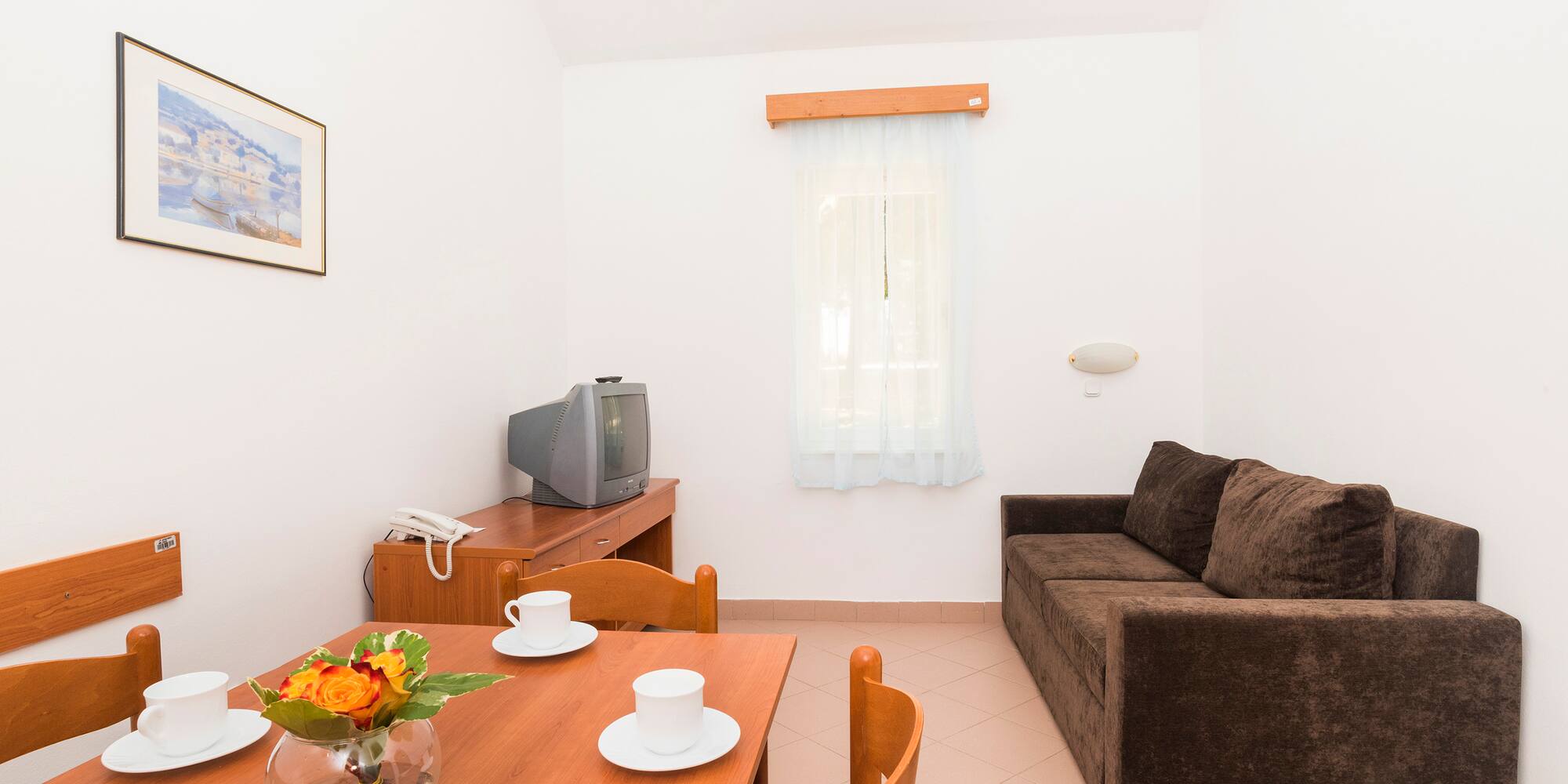 a living room with a couch and tv