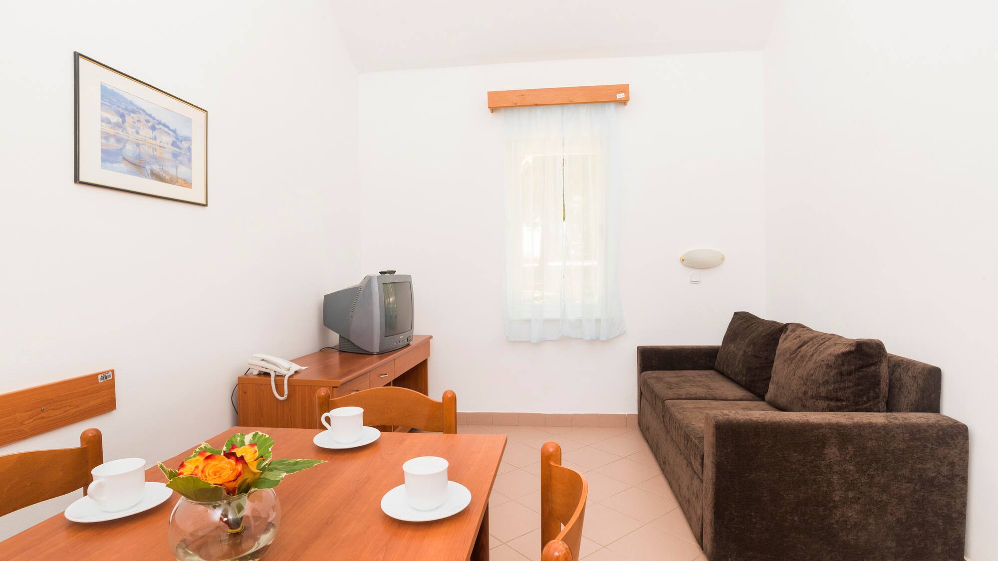 a living room with a couch and tv