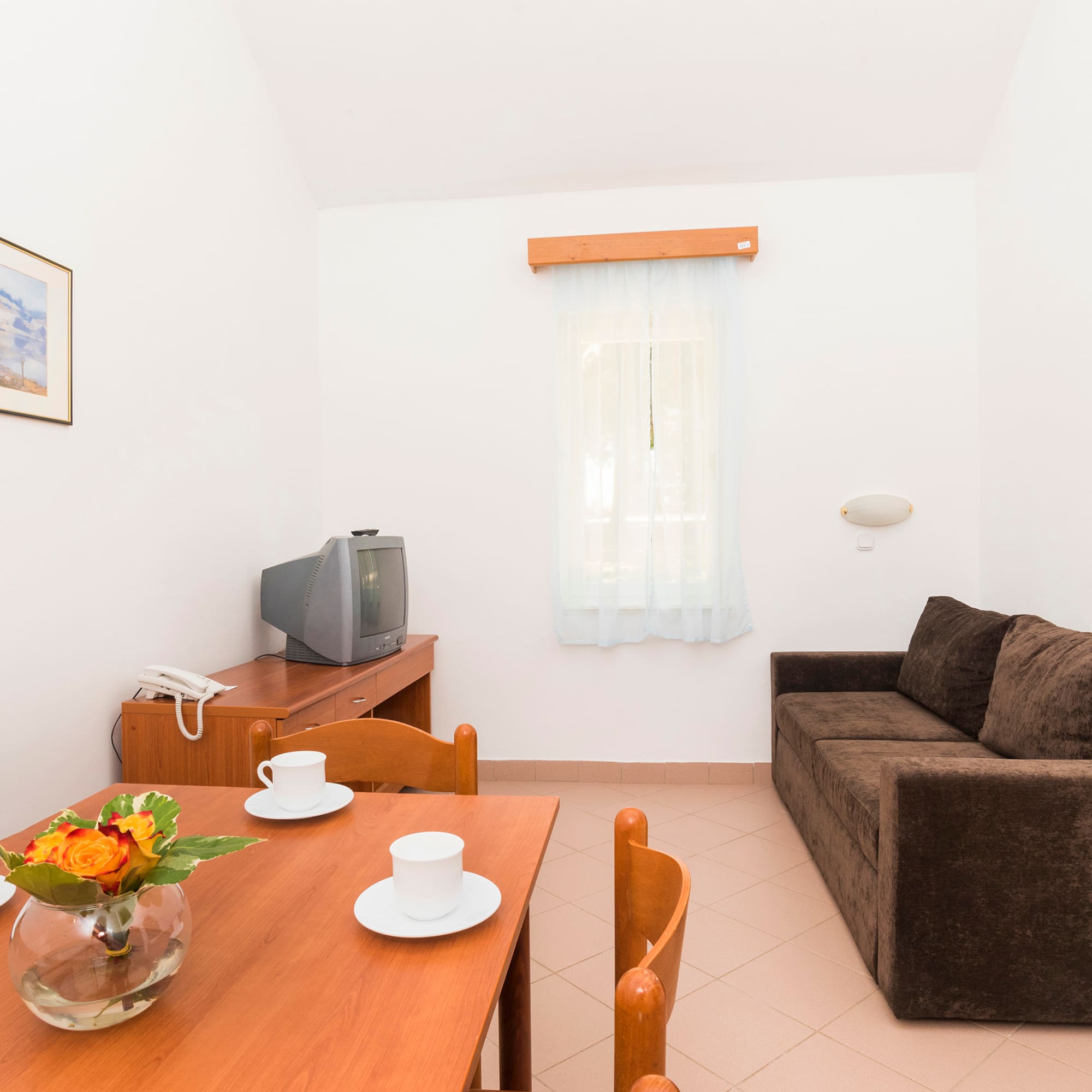 a living room with a couch and tv