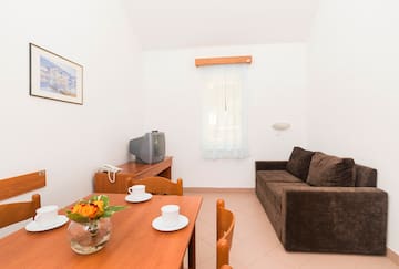 a living room with a couch and tv