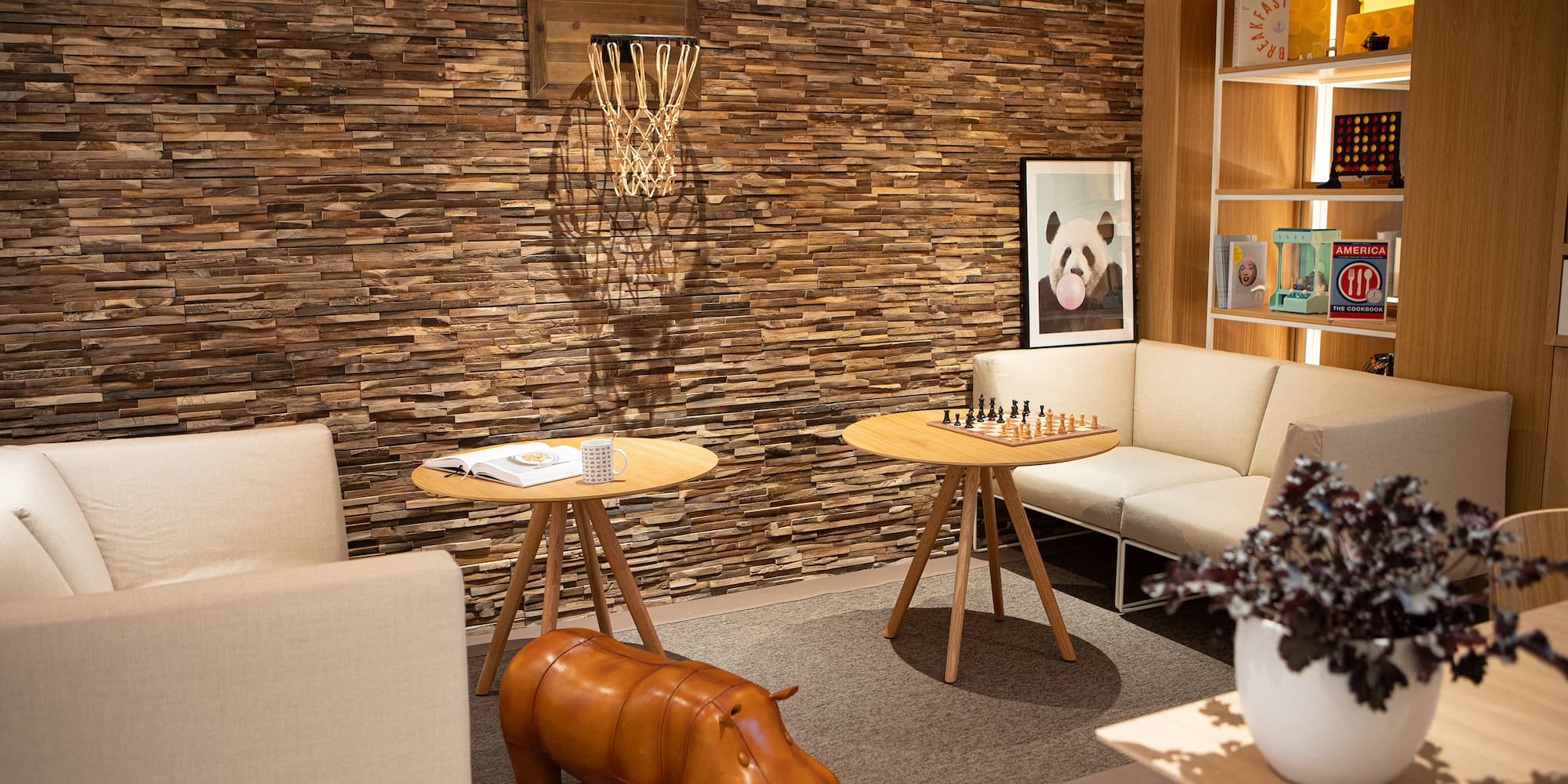 a room with a couch and a table and a chess board