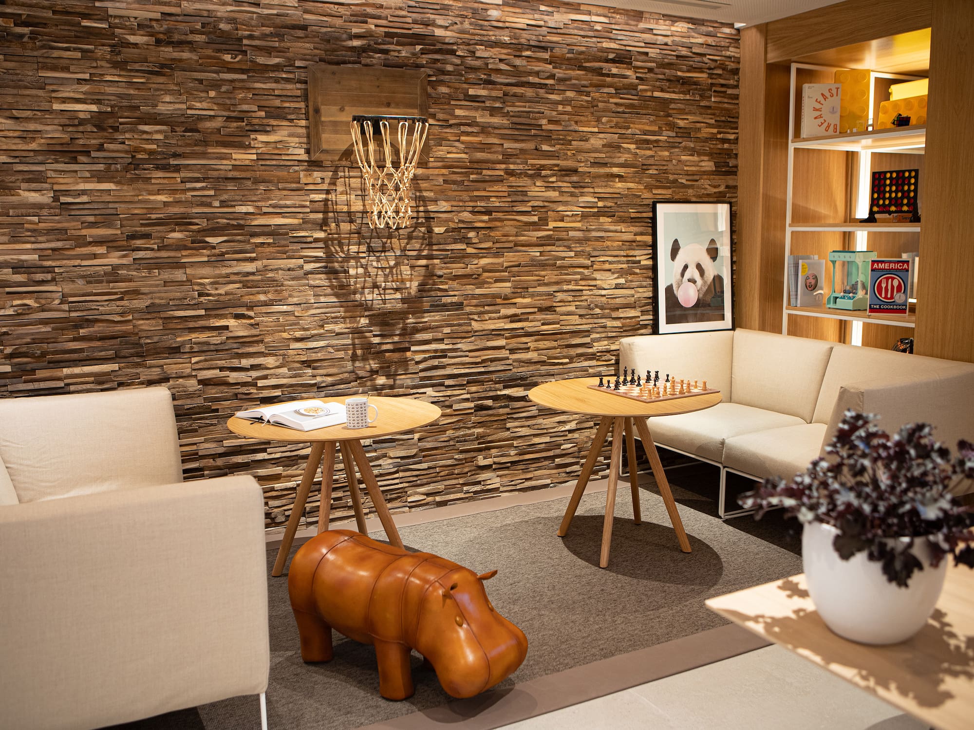 a room with a couch and a table and a chess board