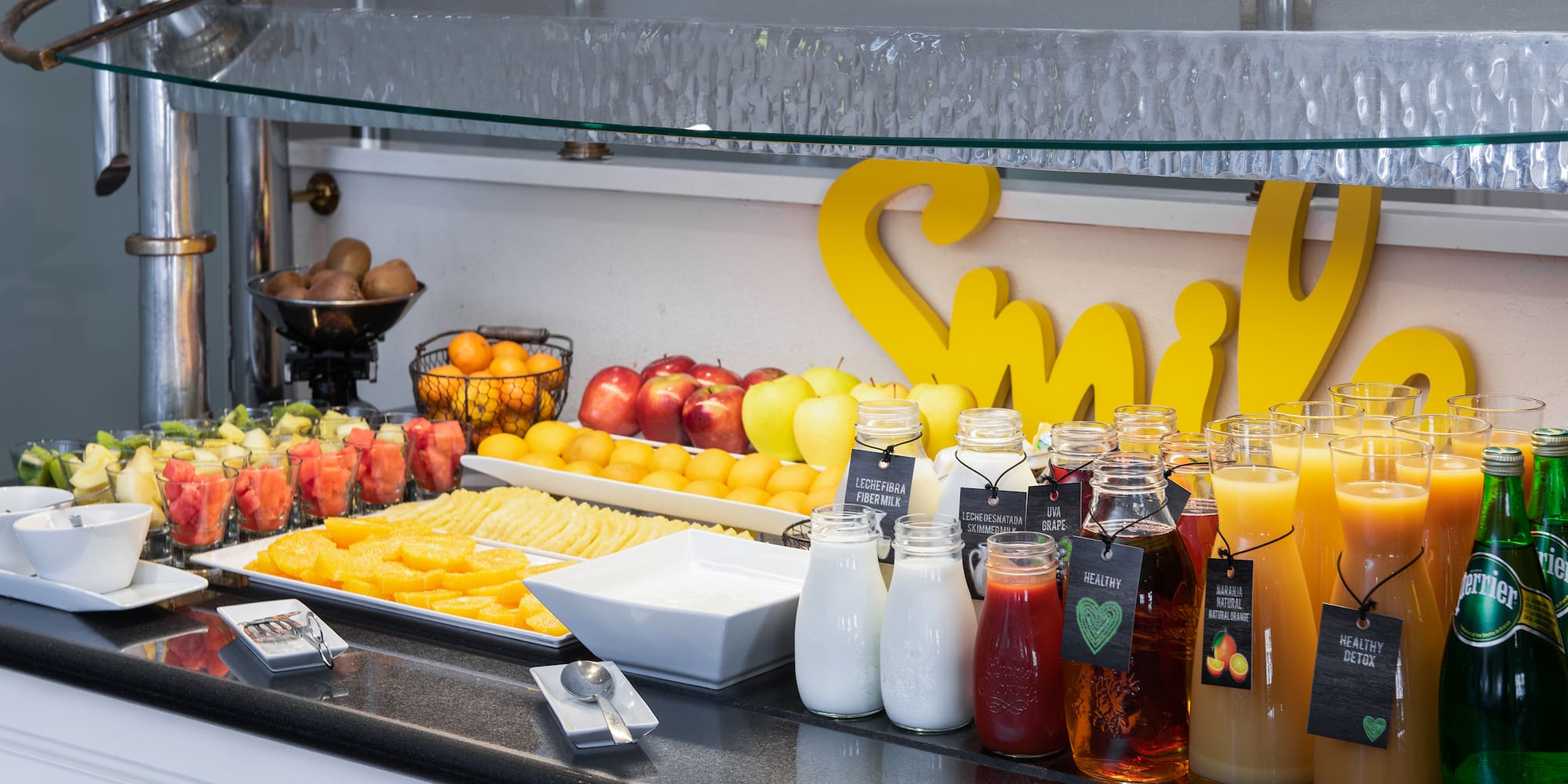 a table with fruit and juices