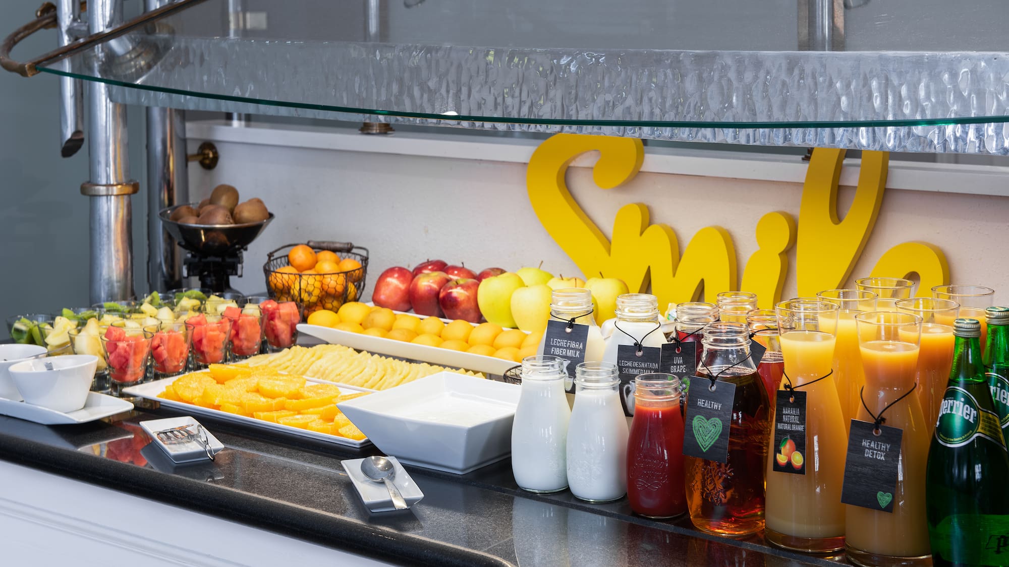 a table with fruit and juices