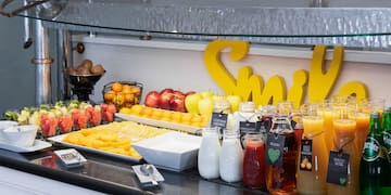 a table with fruit and juices