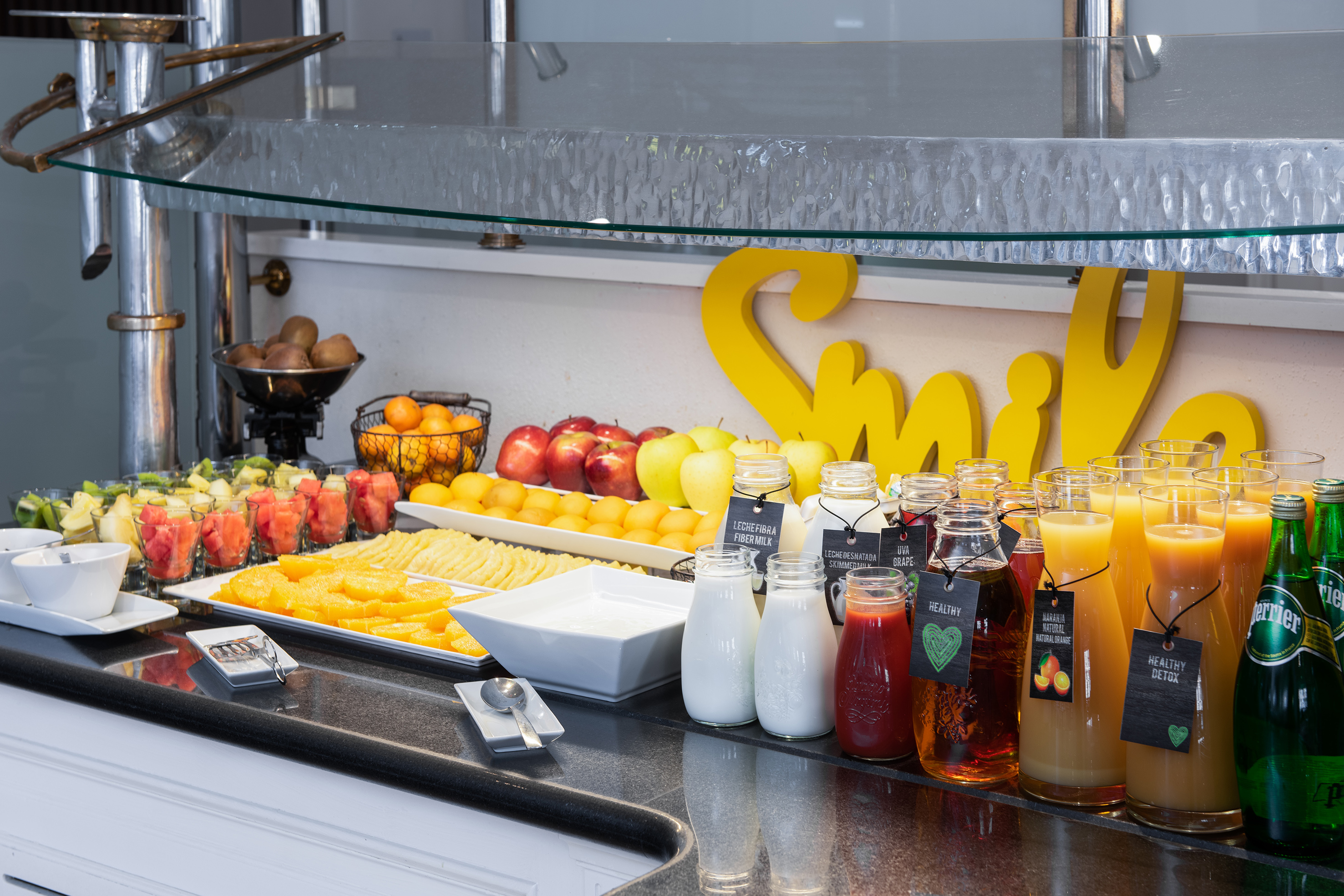 a table with fruit and juices
