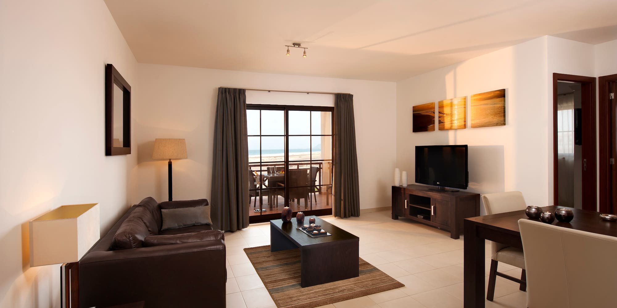 a living room with a television and a table