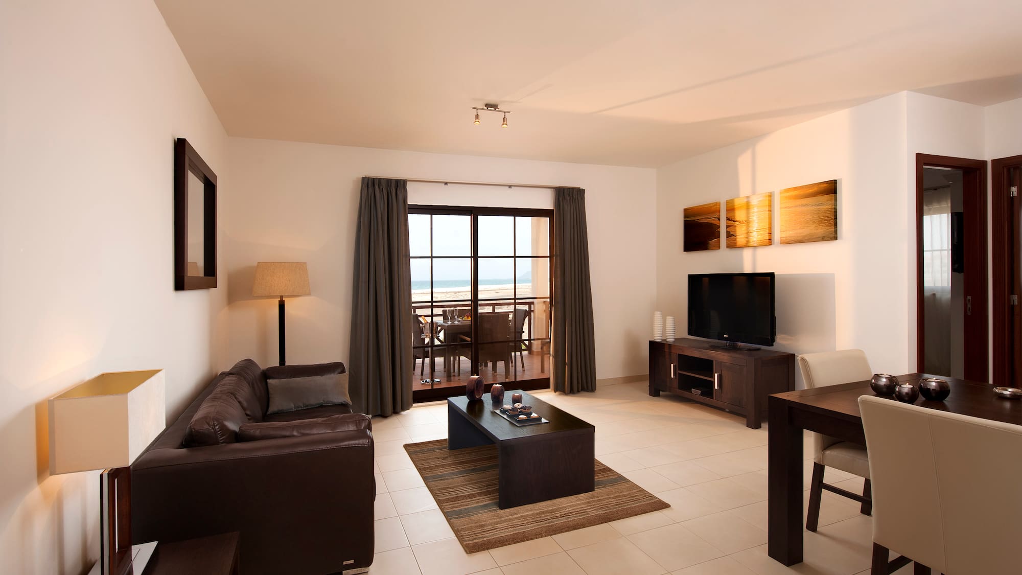 a living room with a television and a table