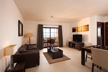 a living room with a television and a table