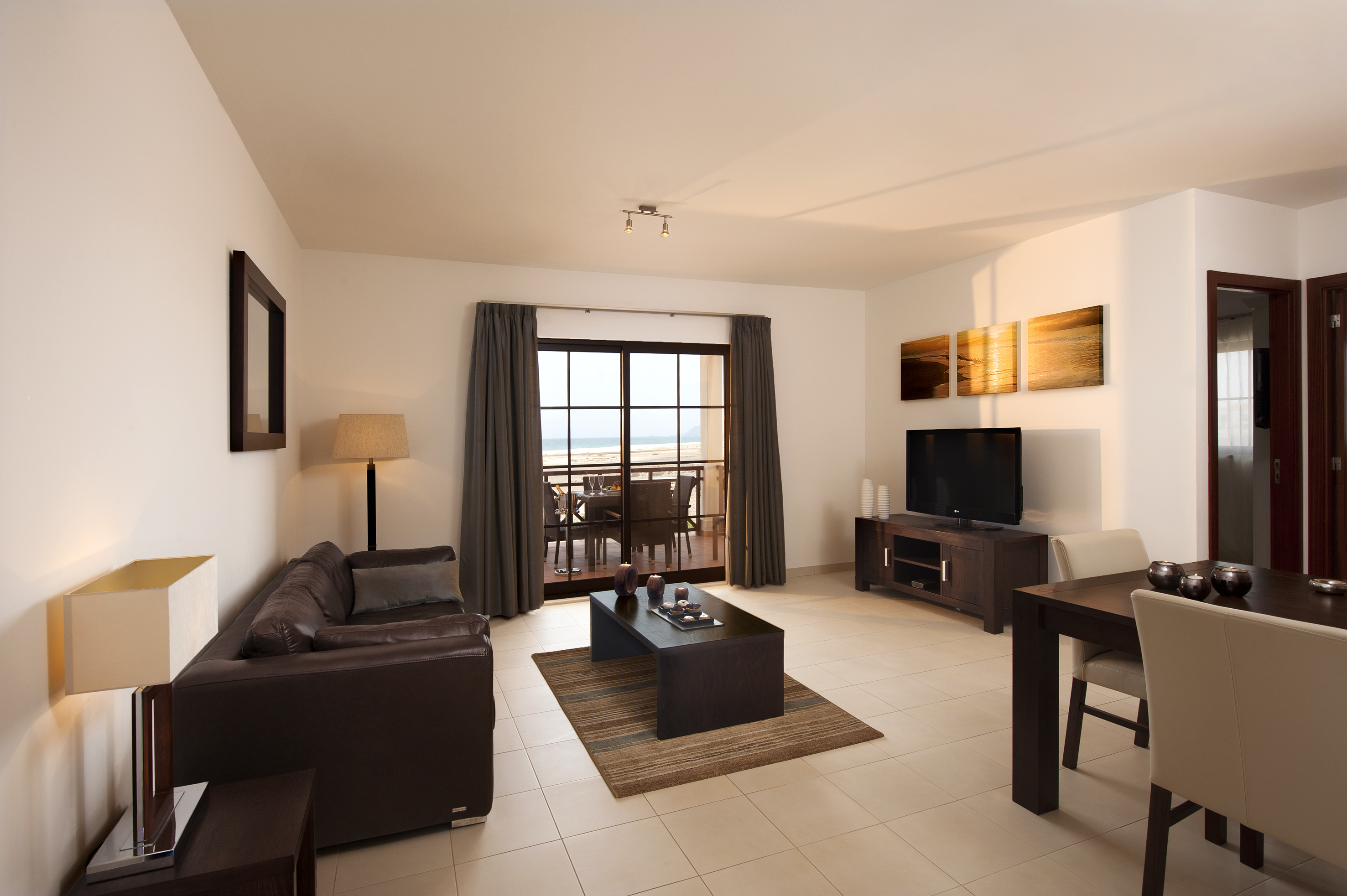 a living room with a television and a table