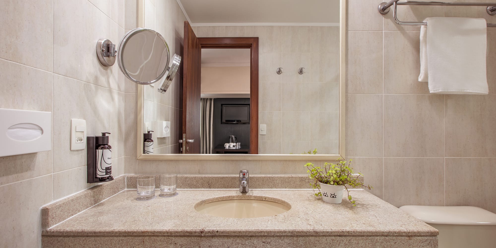 a bathroom with a sink and mirror