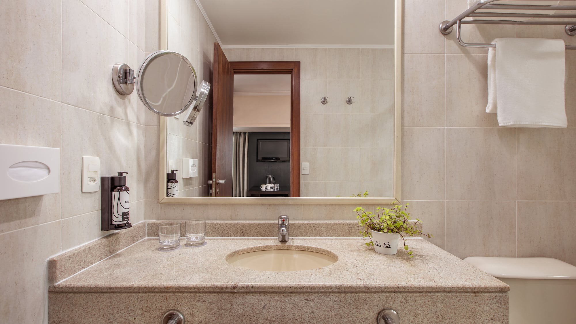 a bathroom with a sink and mirror
