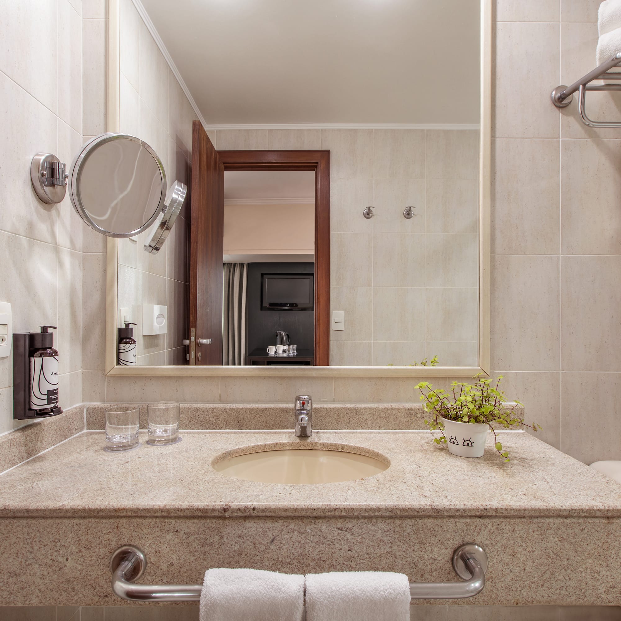 a bathroom with a sink and mirror