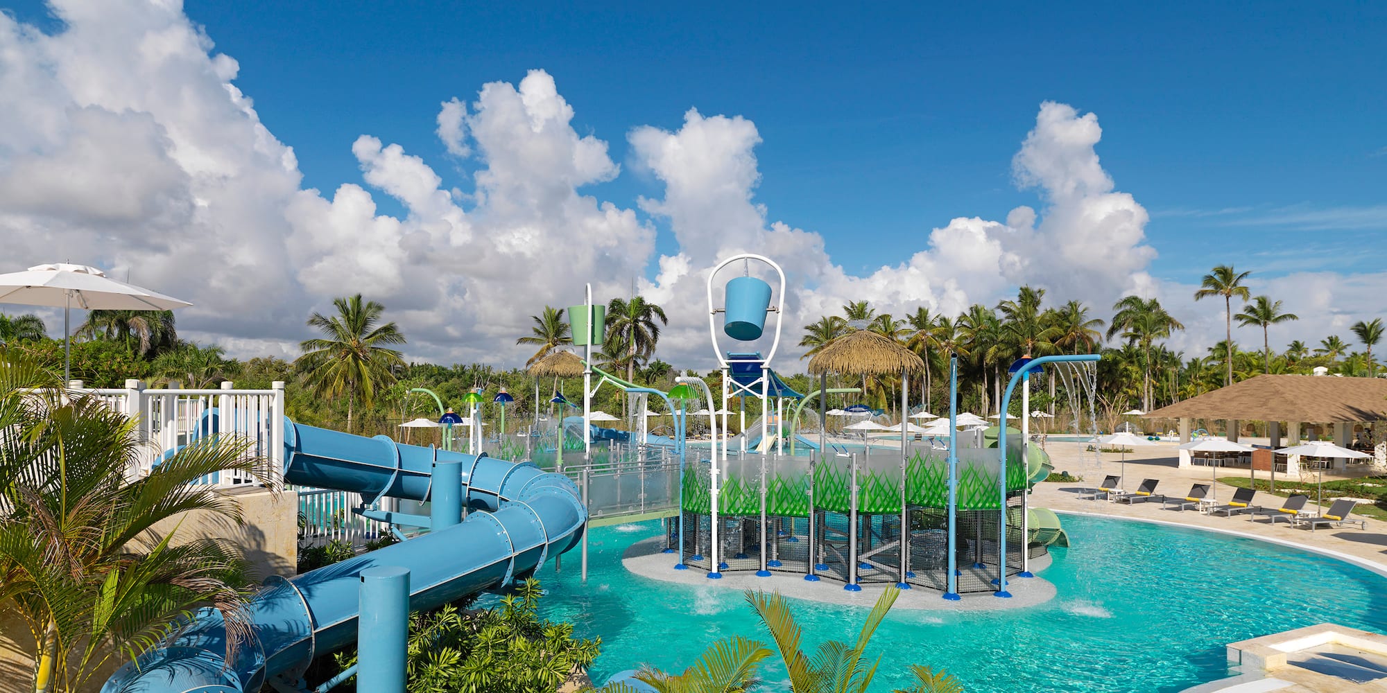 a water park with a slide and a pool