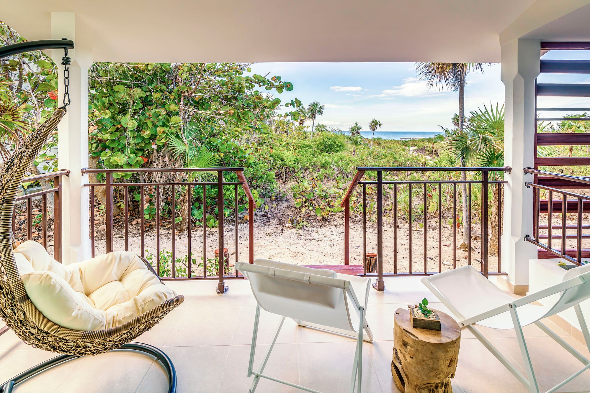 a deck with chairs and a table on it