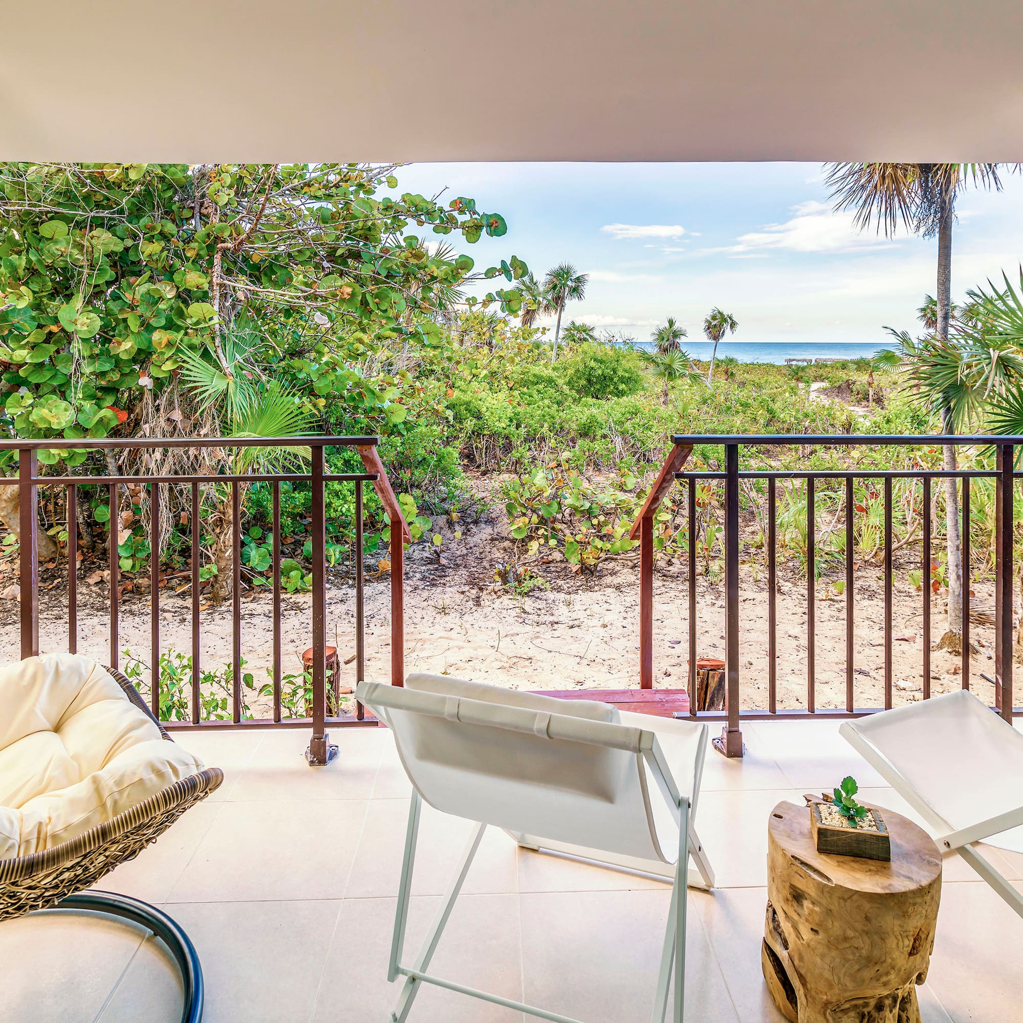 a deck with chairs and a table on it