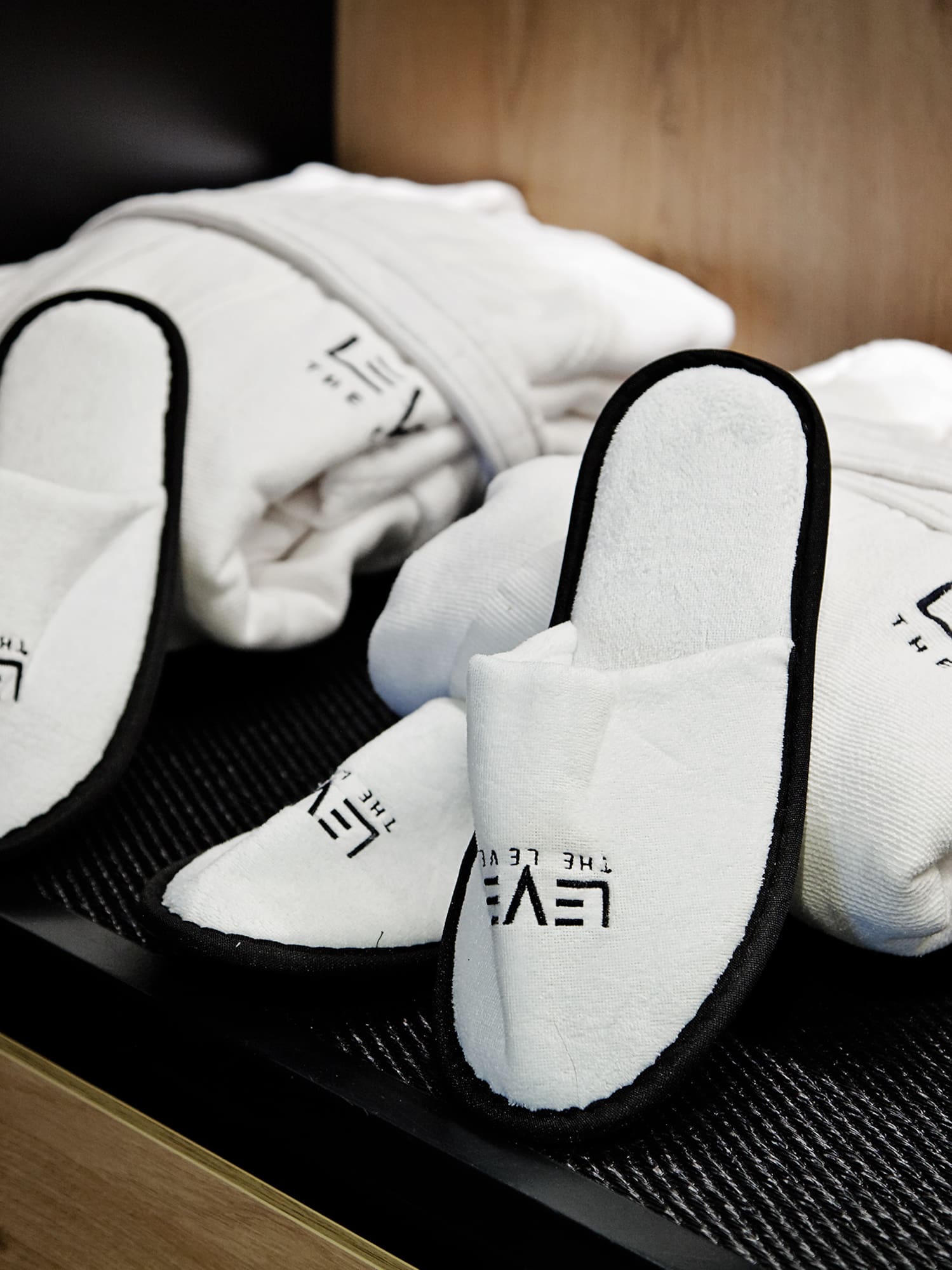 a pair of slippers and a towel on a shelf