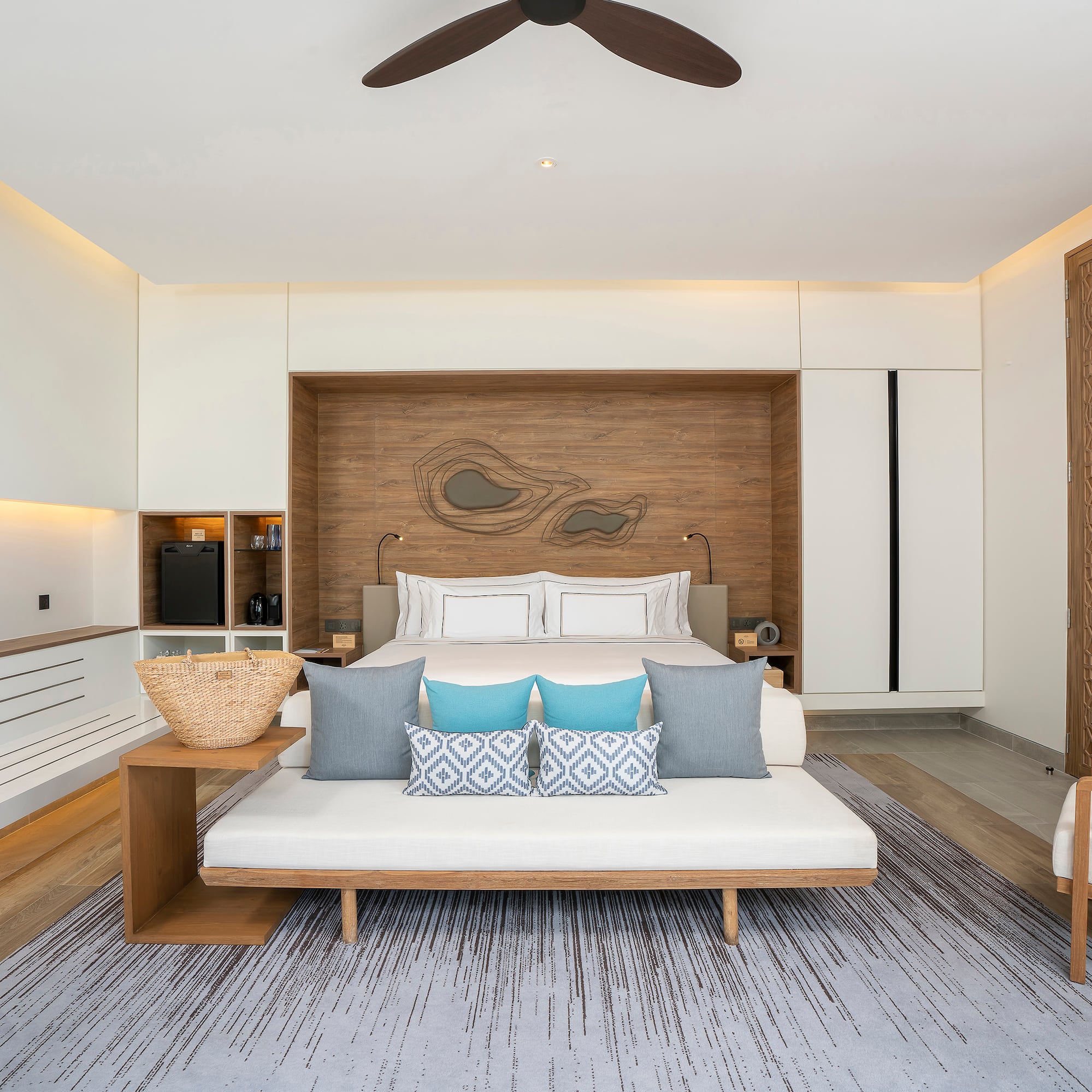 a room with a bed and a fan