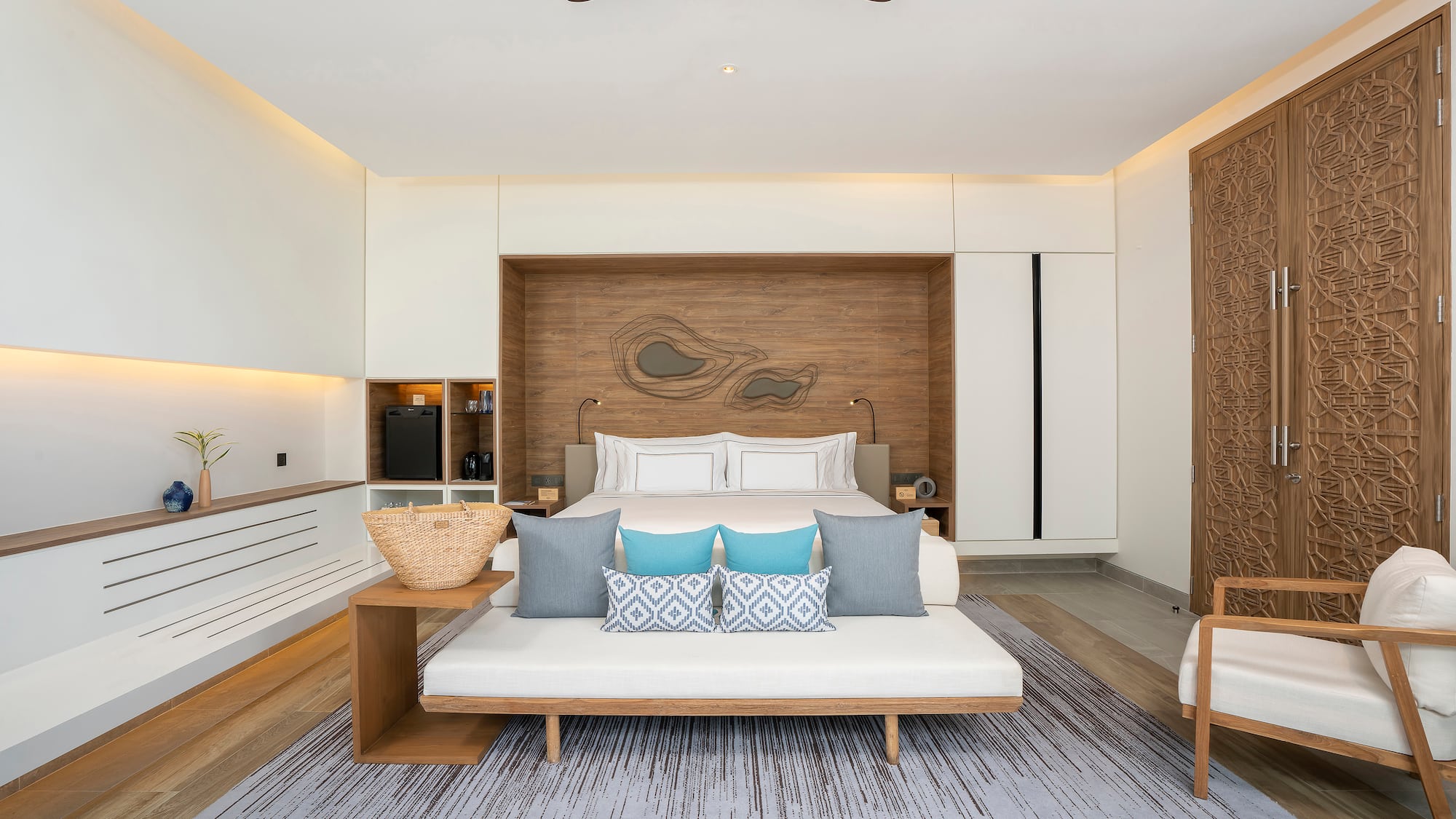 a room with a bed and a fan