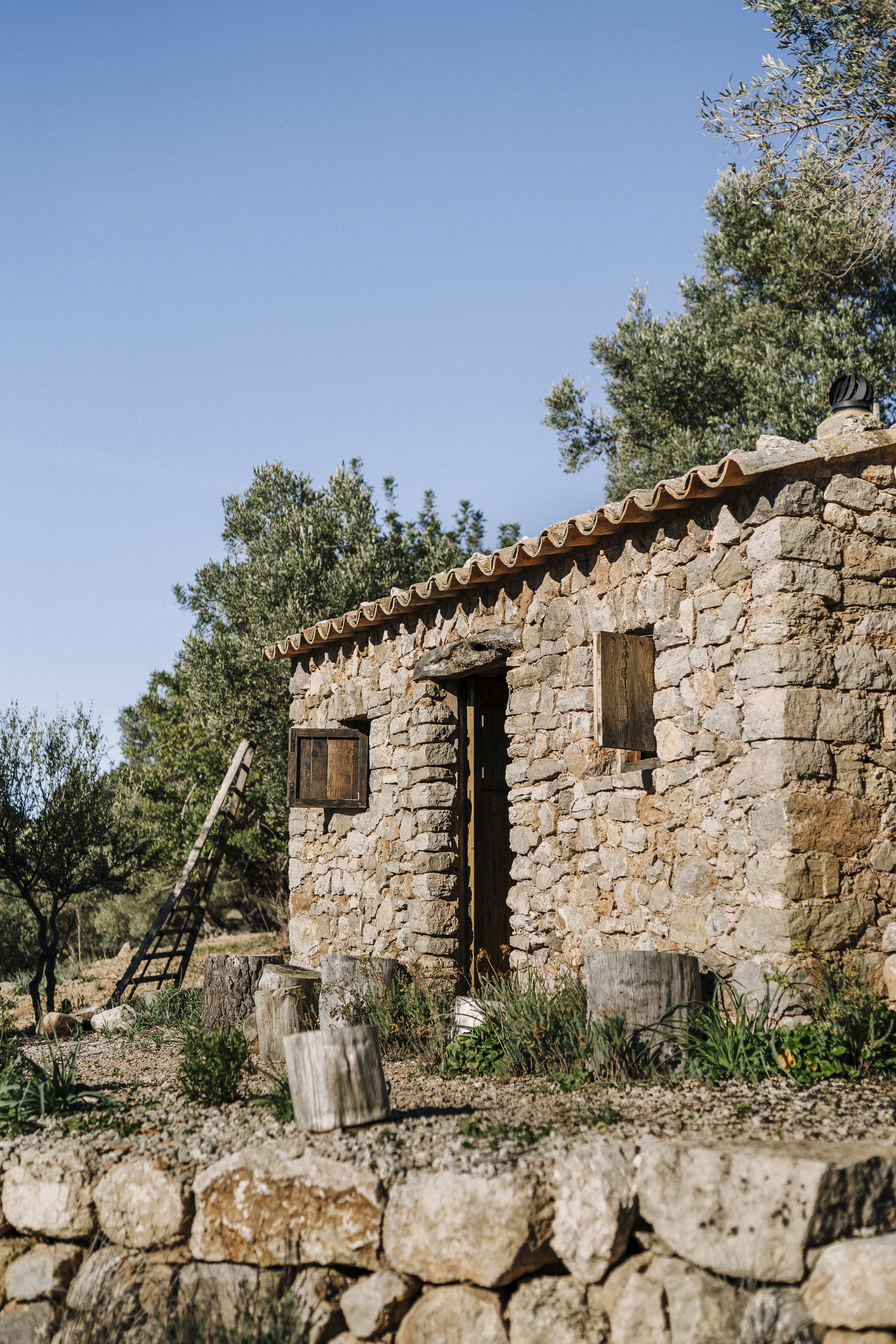 a stone building with a ladder