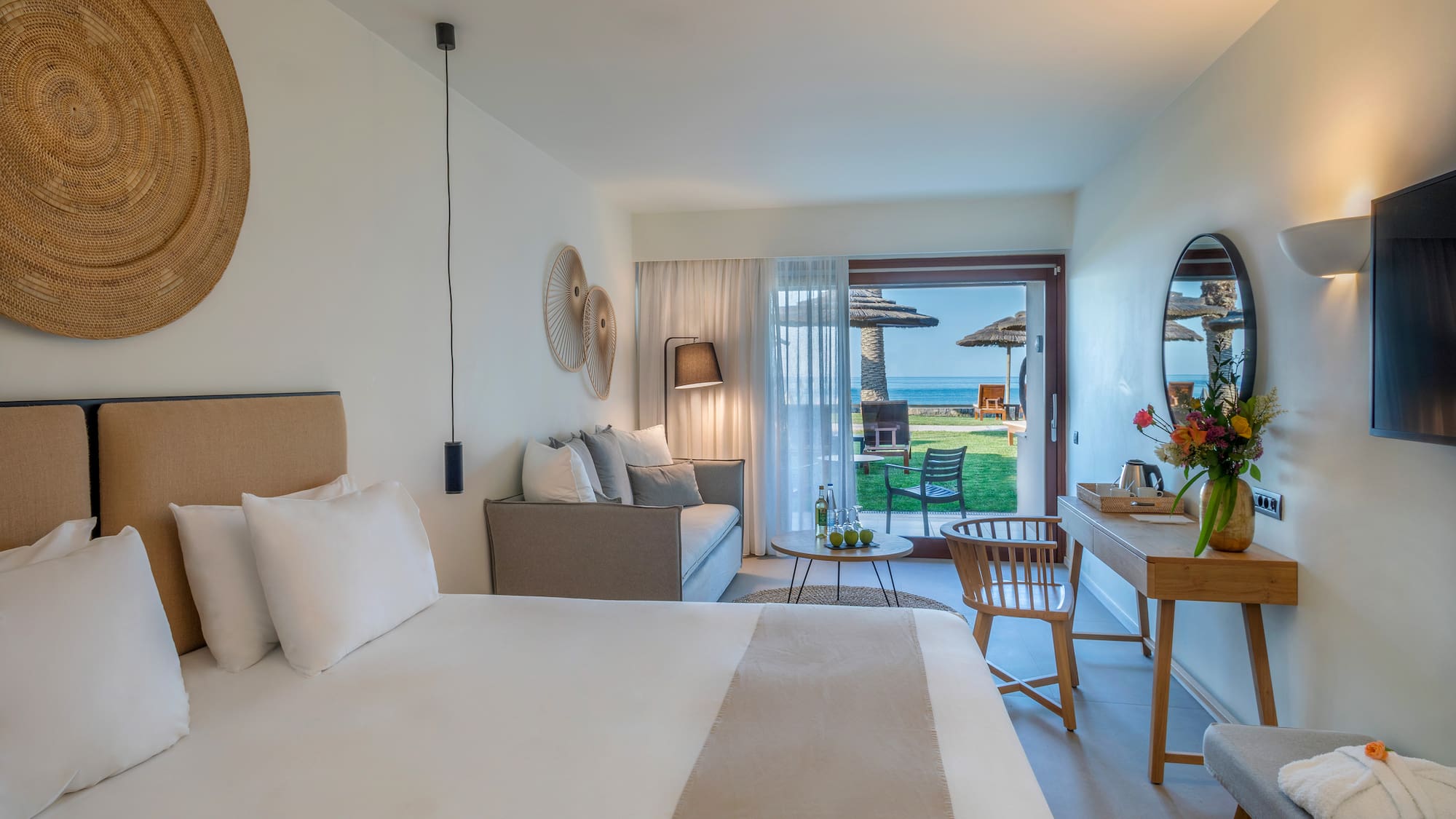 a room with a bed and a table and chairs