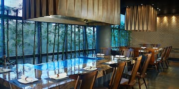 a restaurant with a table and chairs