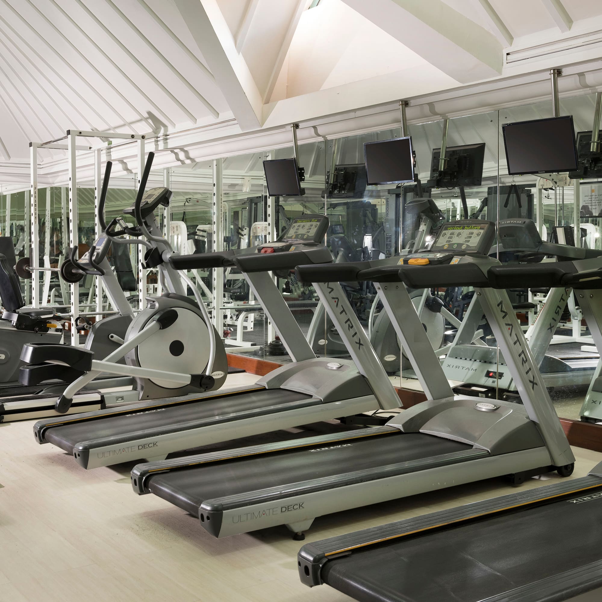 a room with treadmills and exercise machines