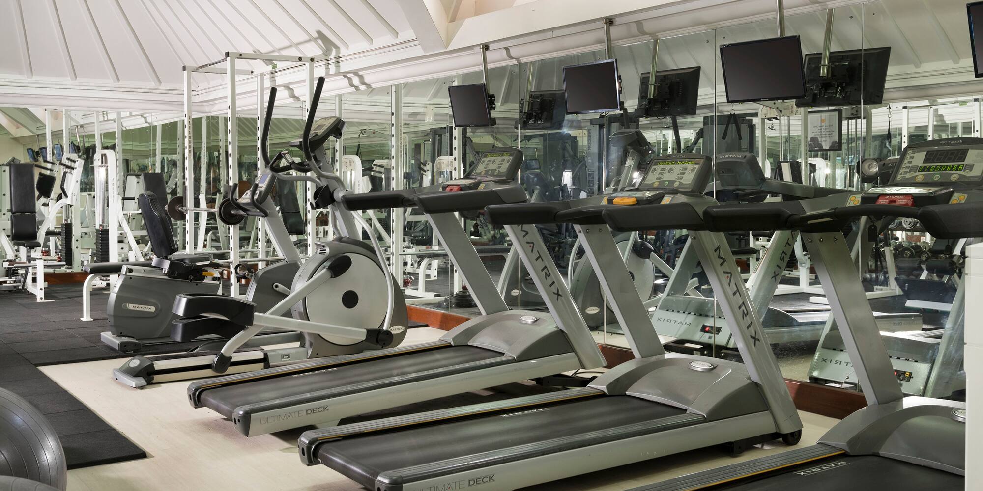 a room with treadmills and exercise machines